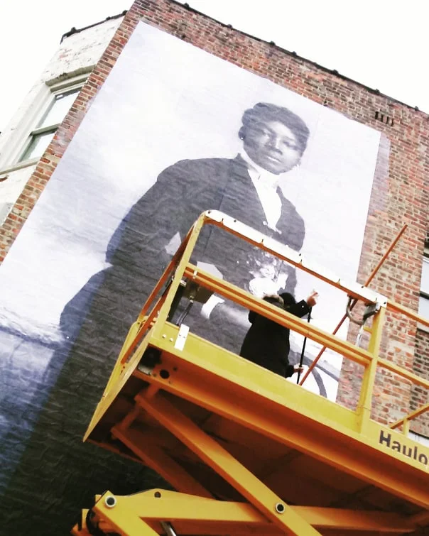 00000 chris installing legacy mural.jpg