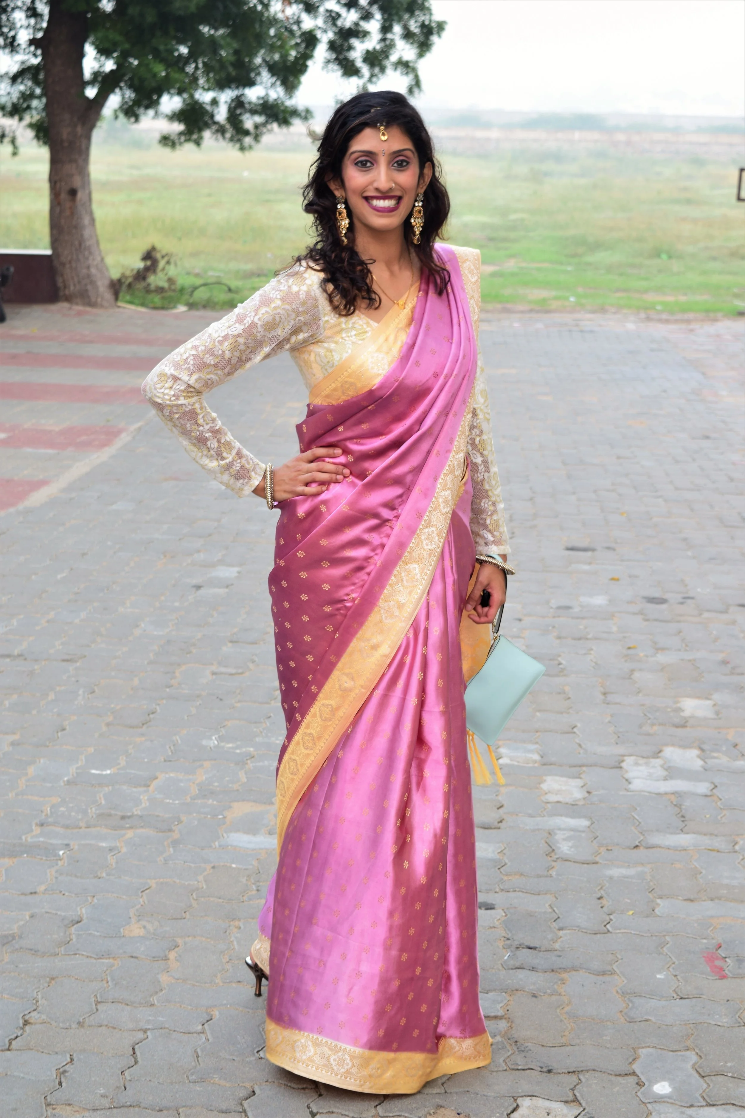 South Indian sari with a contrast long-sleeved lace blouse