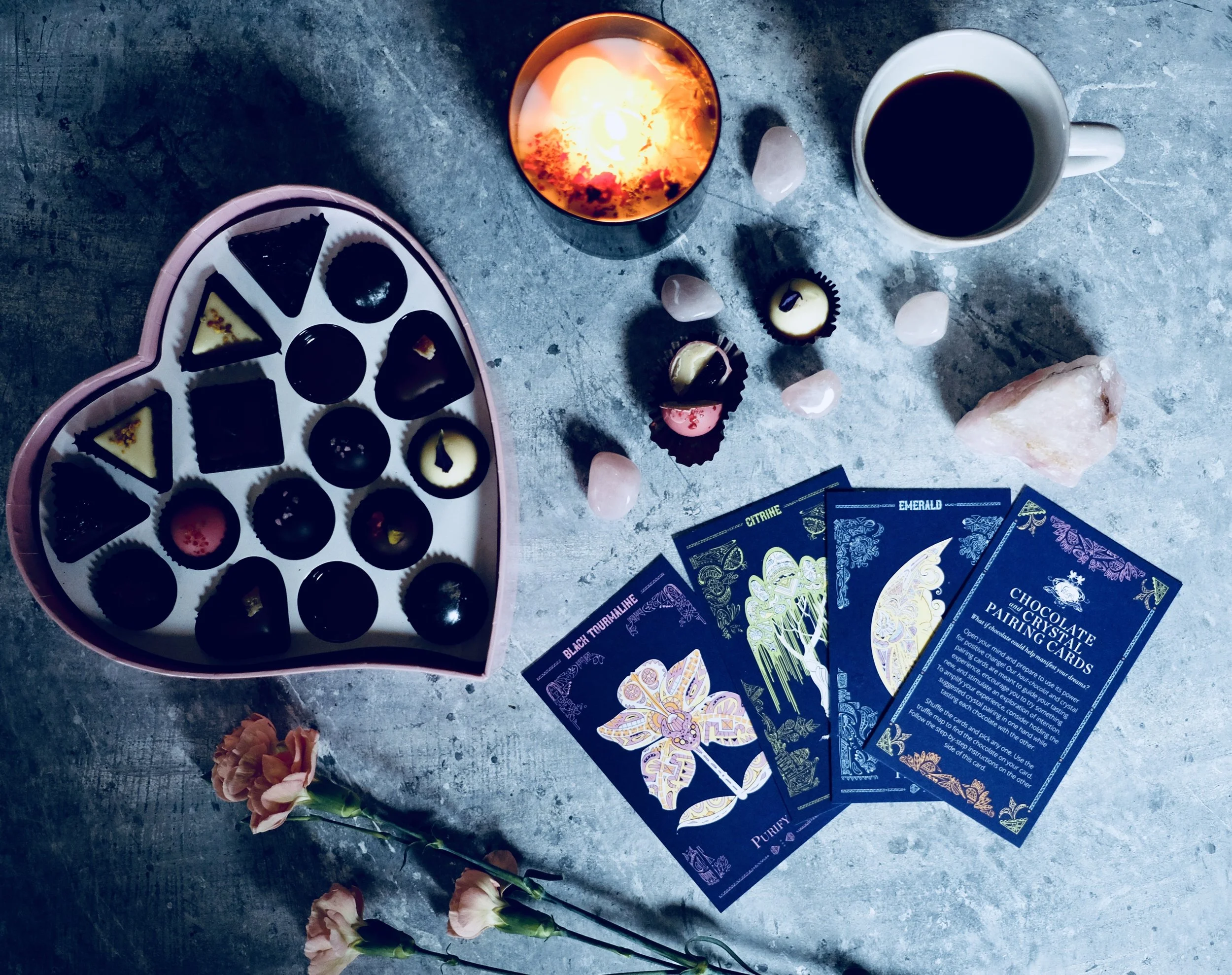 Pictured here Vosges Cosmic Heart Chocolate collection & MARVEL + MOON Tenth Muse candle.
