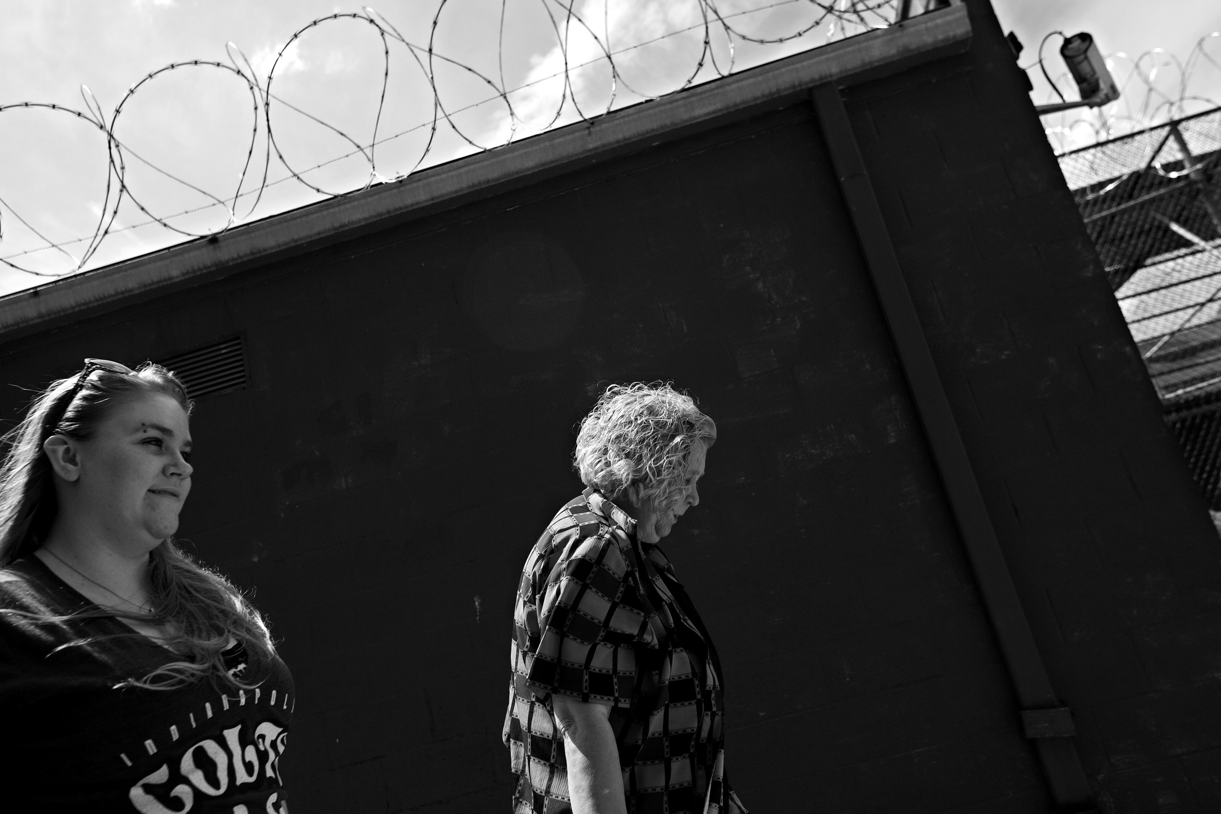 Lynda, right, and Paul’s wife, Kim, leave the Perry County Jail after bringing him money for phone cards for calls home. Paul and Kim are parents to four children. 