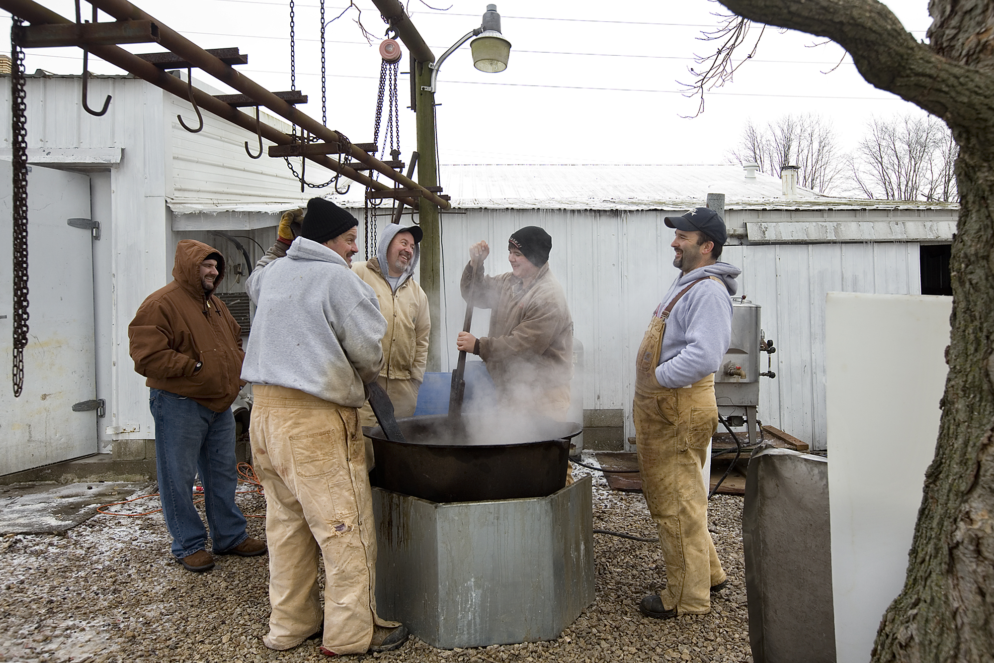 Rendering the lard was one of the last tasks the Schwenk family finished before the final cleanup began. The rendering process requires the lard to be constantly stirred, so Mark Kordes of Jasper, clockwise from front left around the kettle, Roy Mai