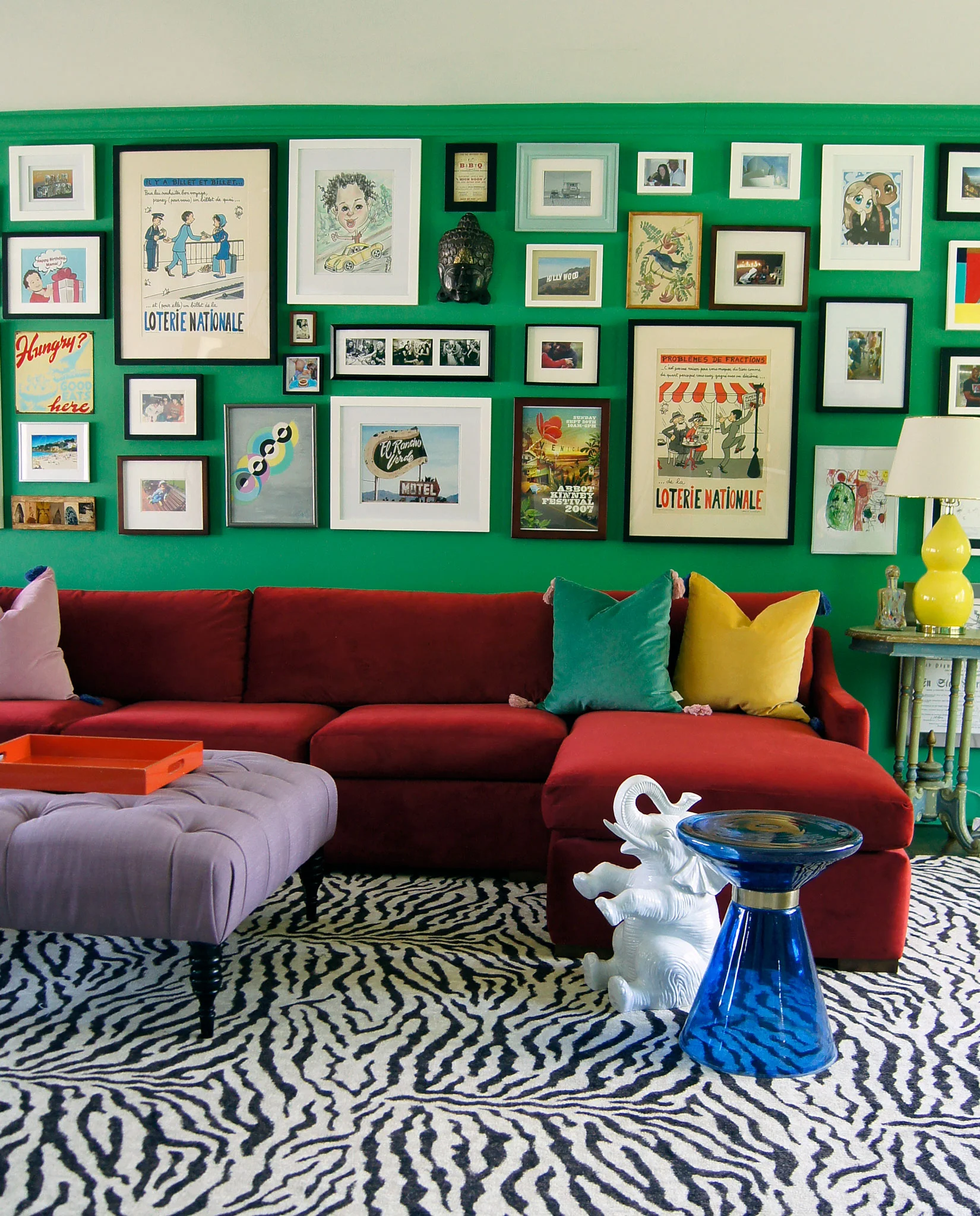modern-eclectic-living-room-zebra-rug-red-sofa.jpg