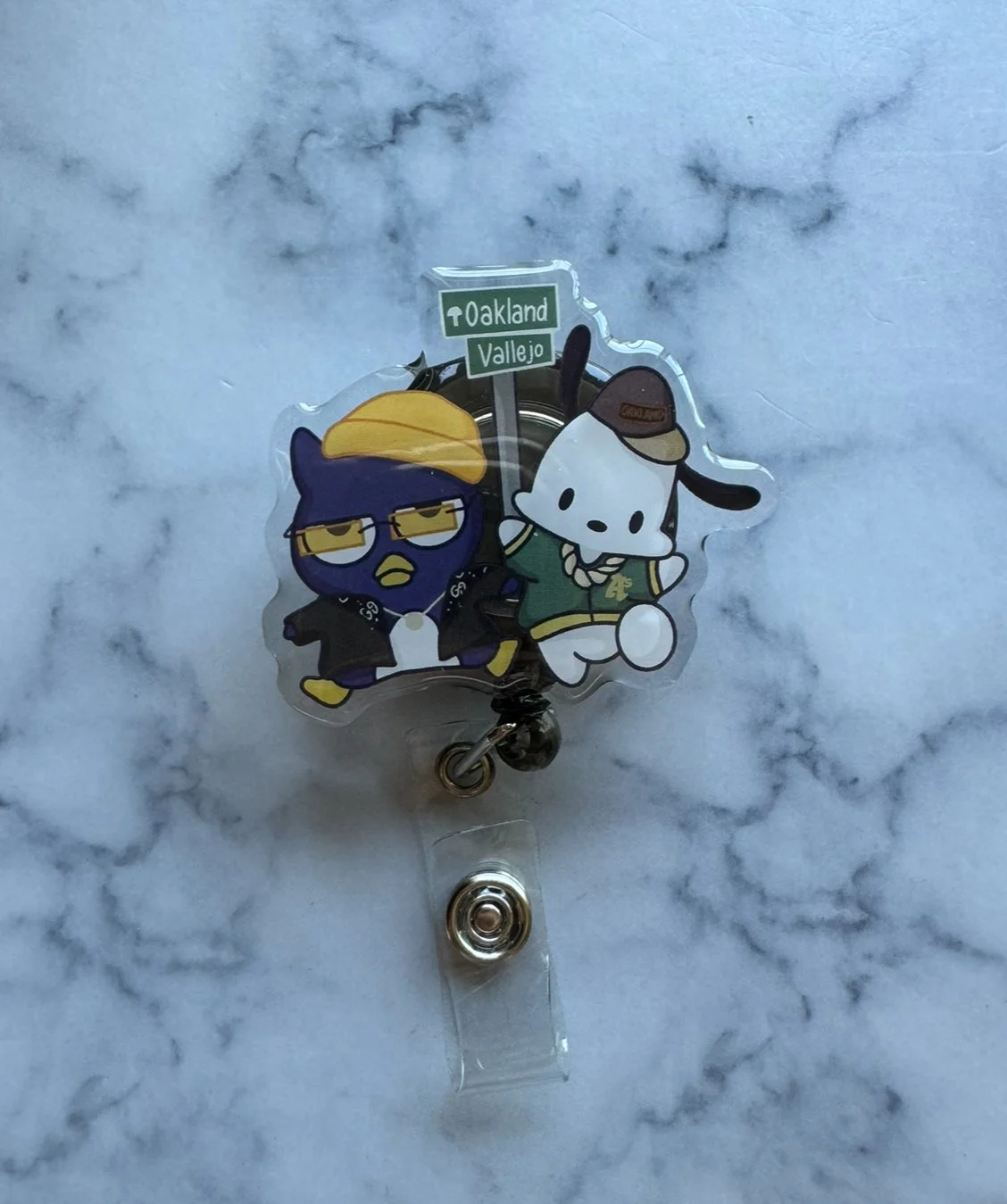penguin x dog badge reel
