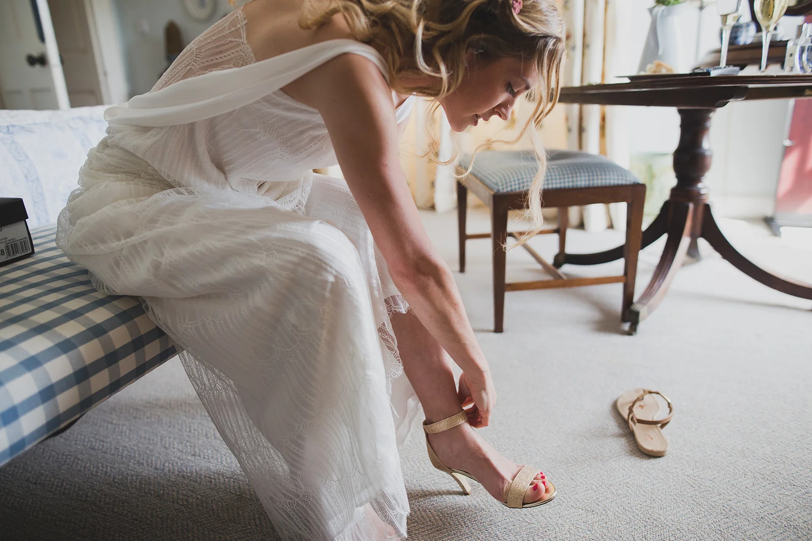 a bride does her shoes up. underlay grange marquee wedding lake district. stop motion wedding films uk