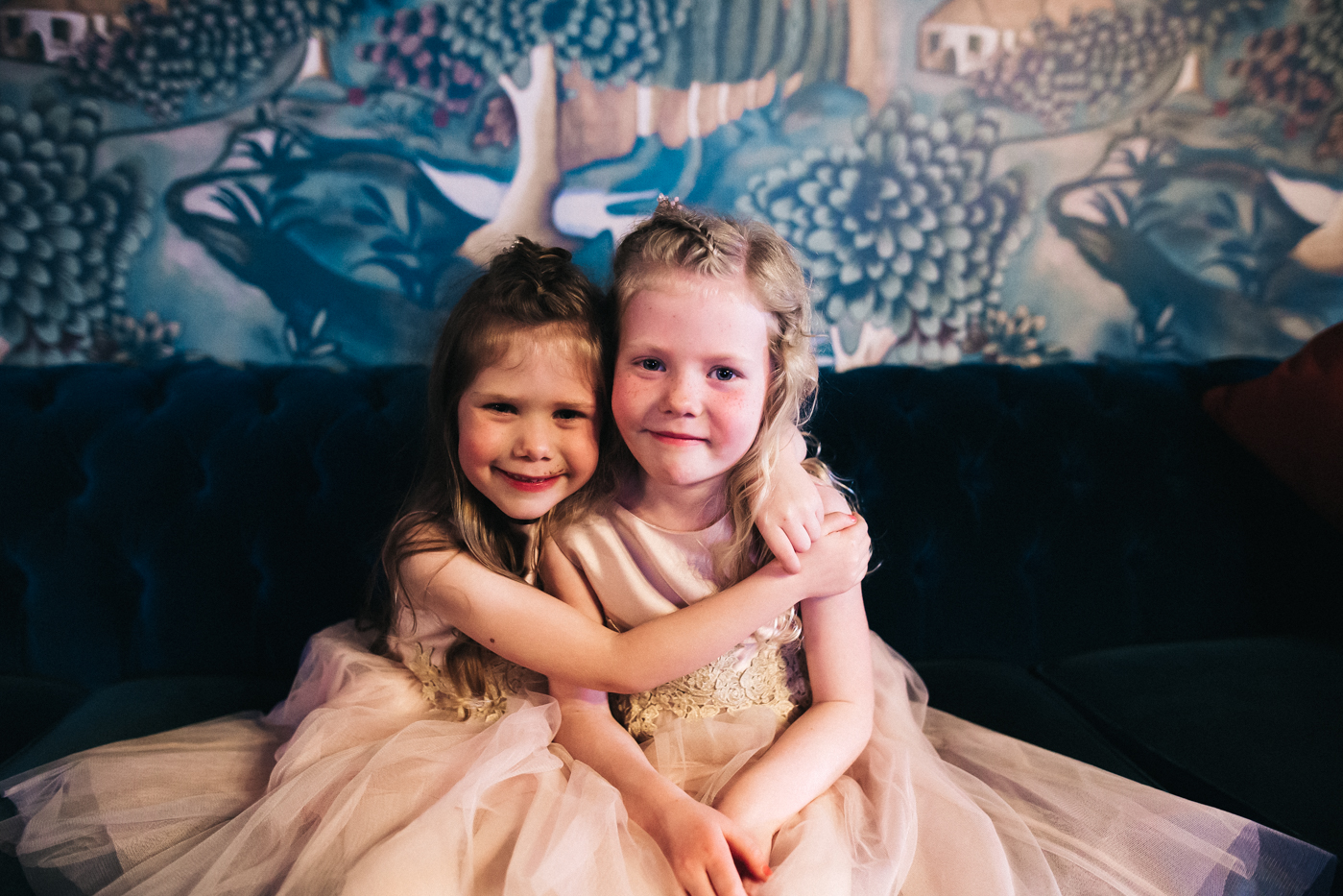 two young girls cuddle. cleveland tontine wedding teesside north yorkshire - relaxed and creative wedding photographer