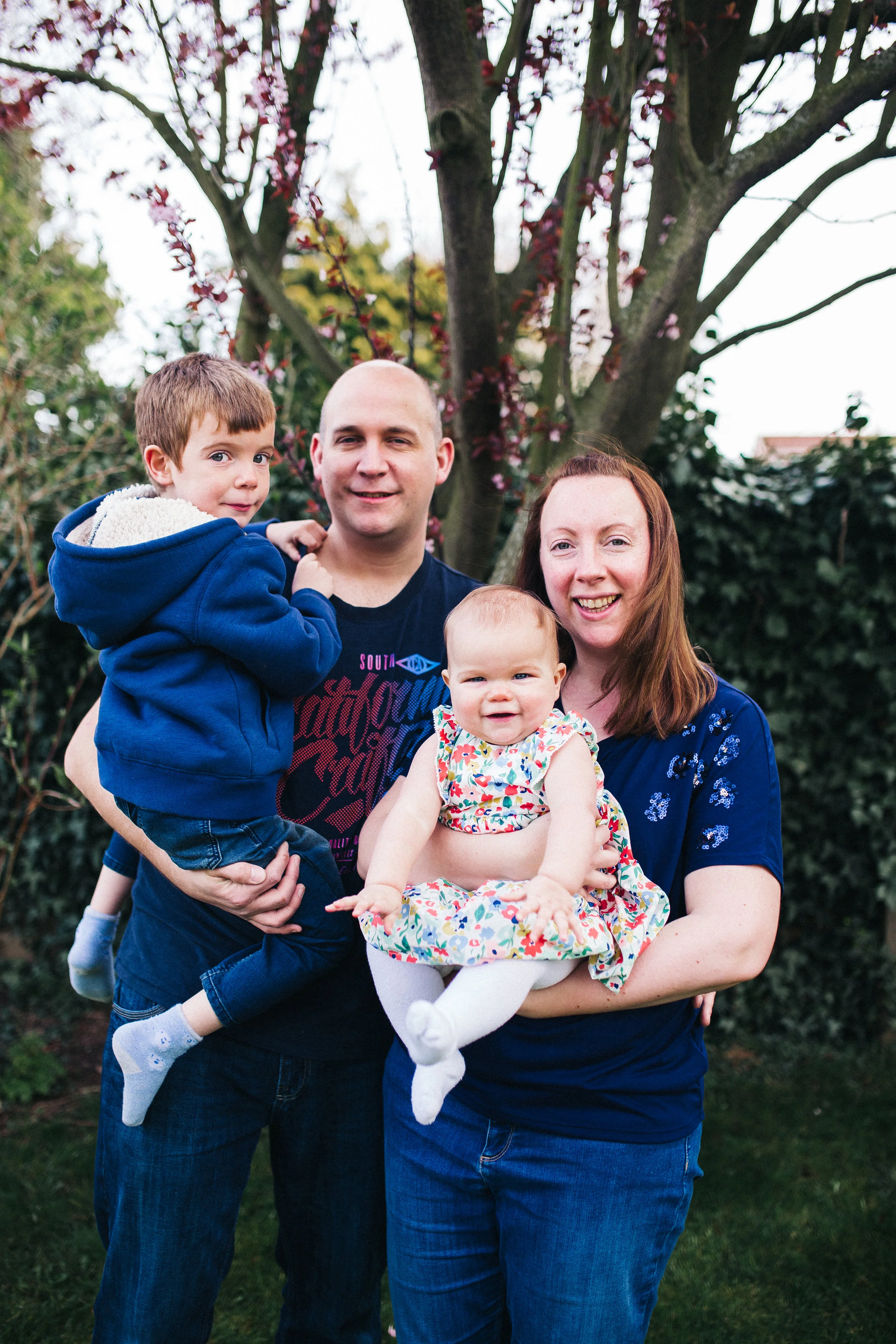 a family photo with a dad, mum, baby girl and boy. creative relaxed family photography teesside middlesbrough stockton north east