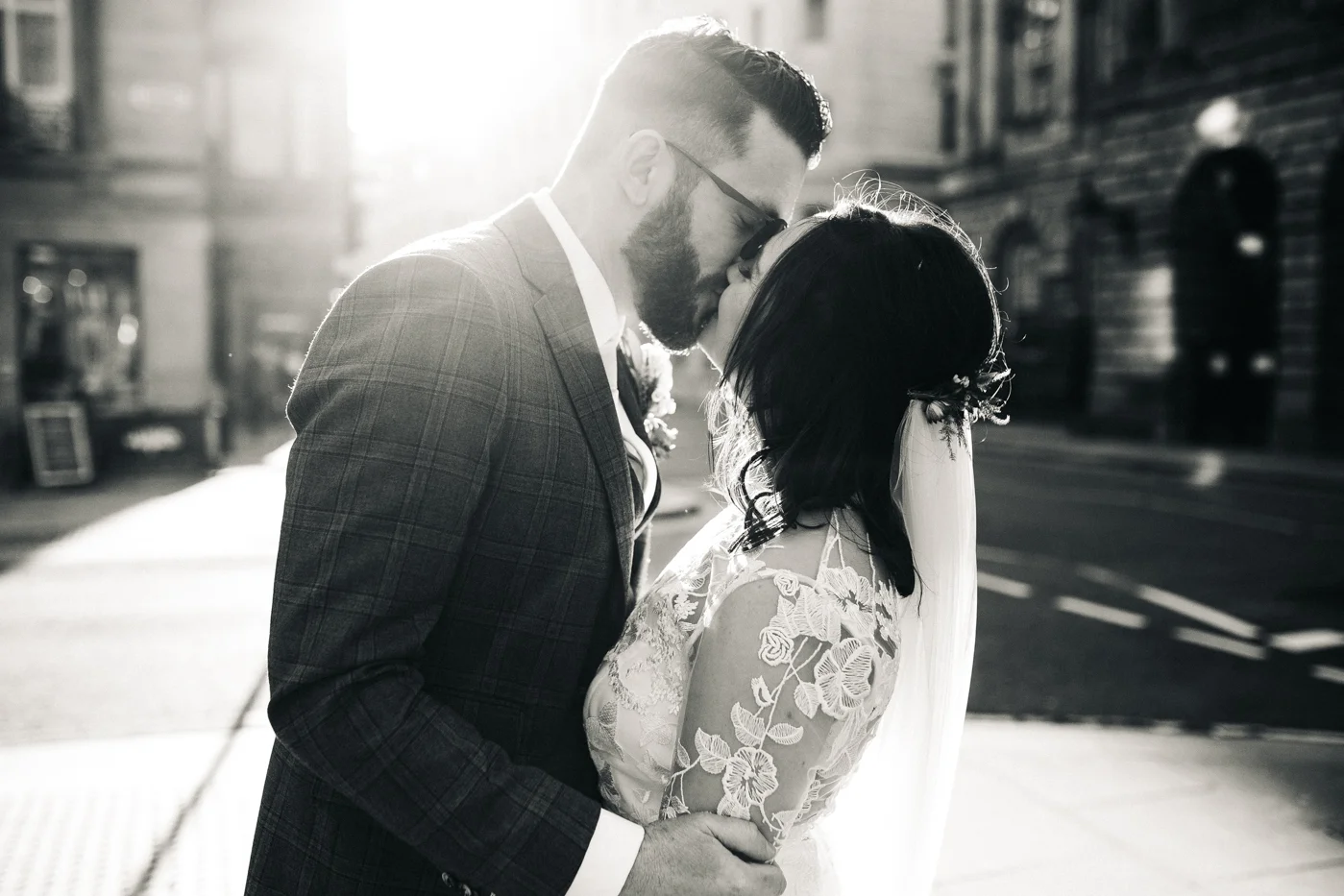 a black and white shot of the bride and groom kissing. ceremony at st georges hall liverpool, oh me oh my wedding reception, north west wedding photographer