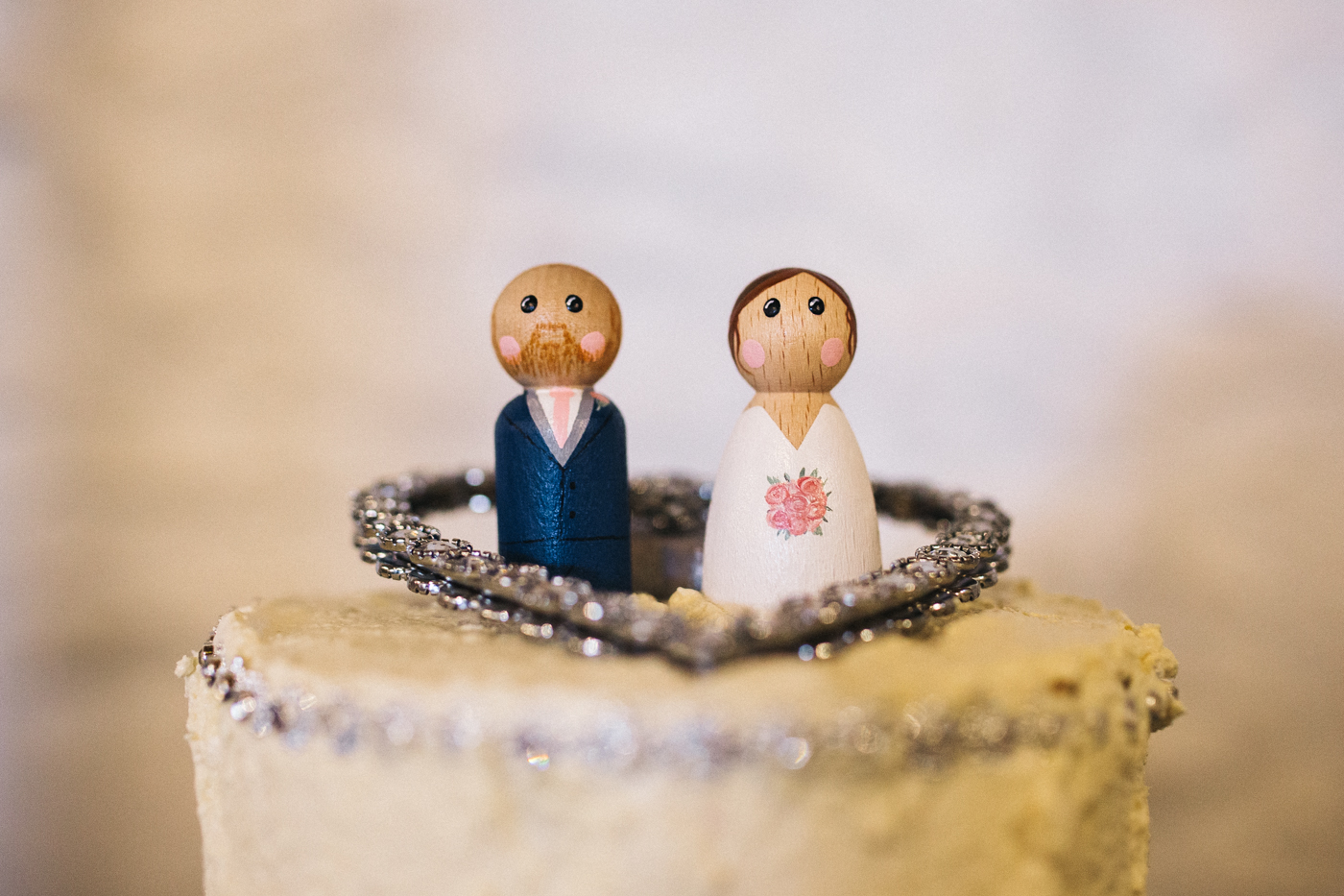 wooden peg doll wedding cake toppers. spring barn wedding at east riddlesden hall keighley west yorkshire wedding photographer