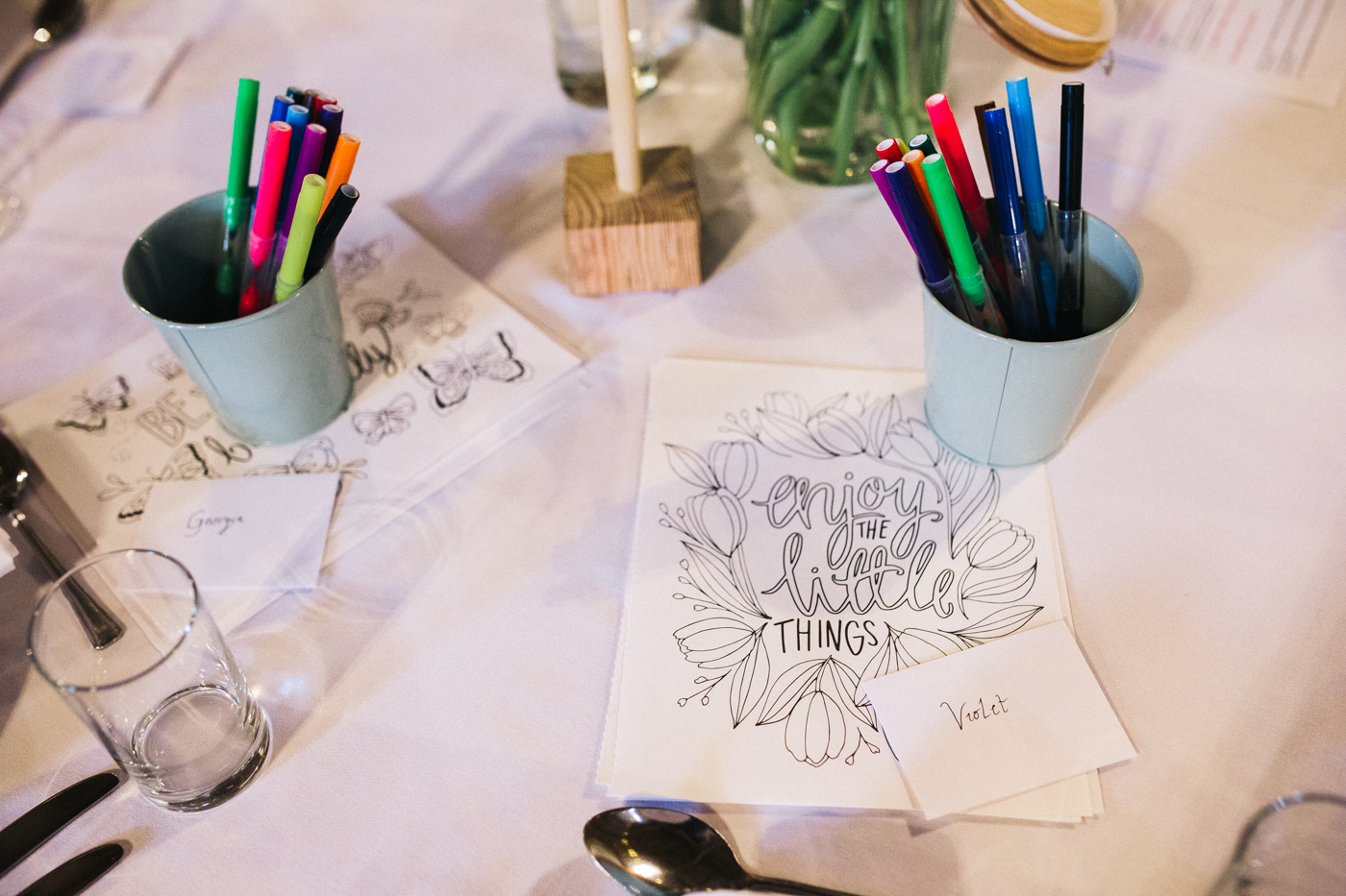 kids activities on the wedding tables. spring barn wedding at east riddlesden hall keighley west yorkshire wedding photographer