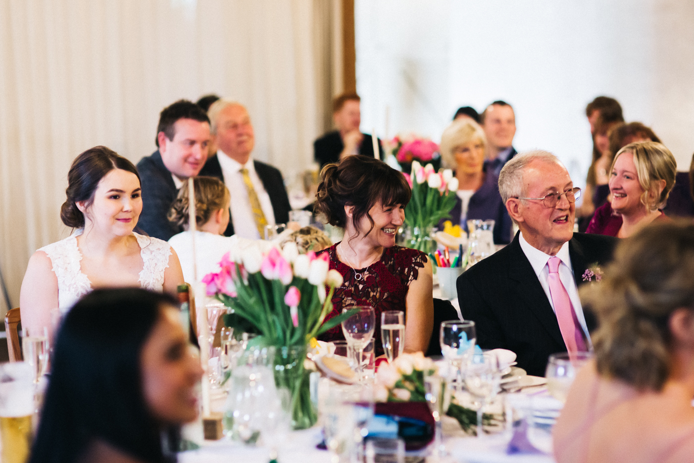 the speeches at the wedding. wide shot. spring barn wedding at east riddlesden hall keighley west yorkshire wedding photographer
