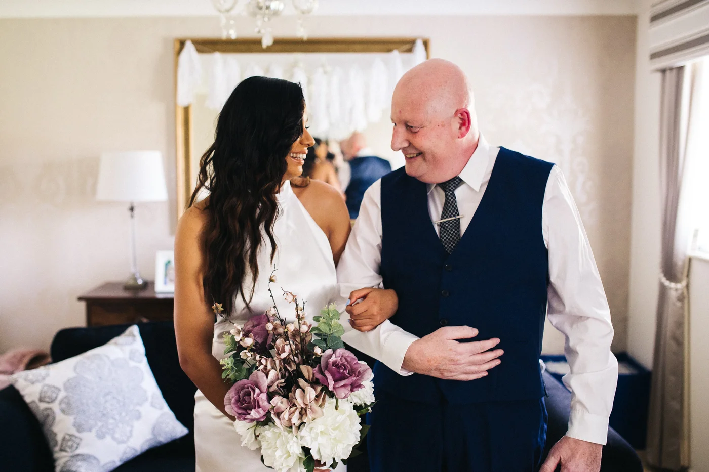 the bride and her dad look at each other smiling. relaxed teesside middlesbrough wedding photographer, wedding at home