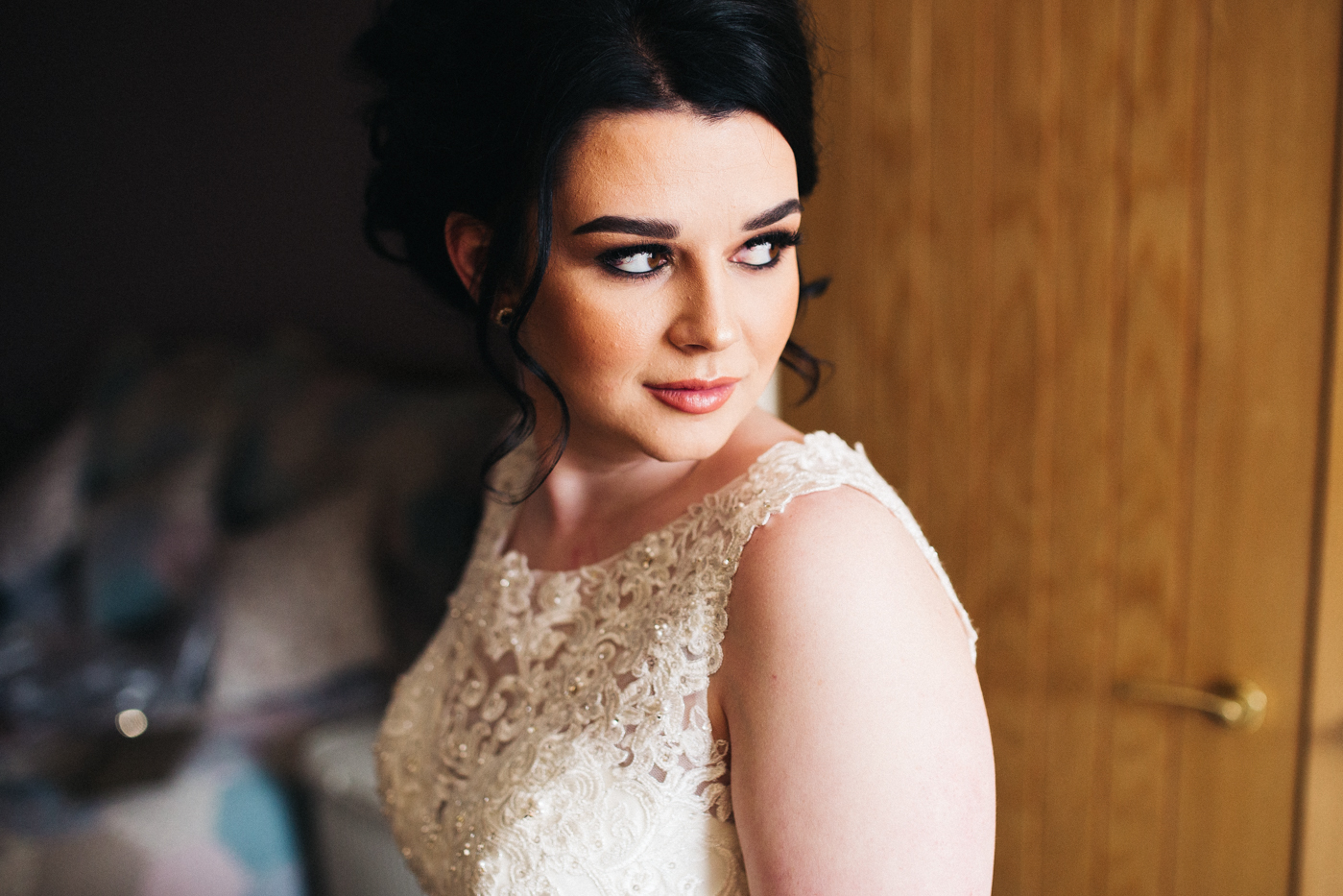 a bride looks over her shoulder, ready in her dress. preston park museum wedding stockton teesside middlesbrough wedding photographer