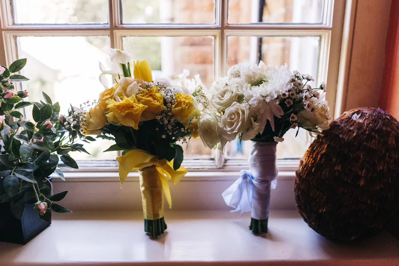 yellow and white bouquets on a windowsil. wedding at laskill house north yorkshire helmsley wedding photographer north east teesside