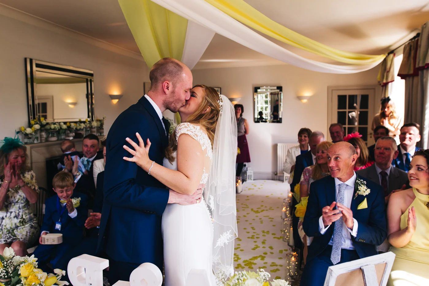 the bride and groom kiss during the ceremony. wedding at laskill house north yorkshire helmsley wedding photographer north east teesside