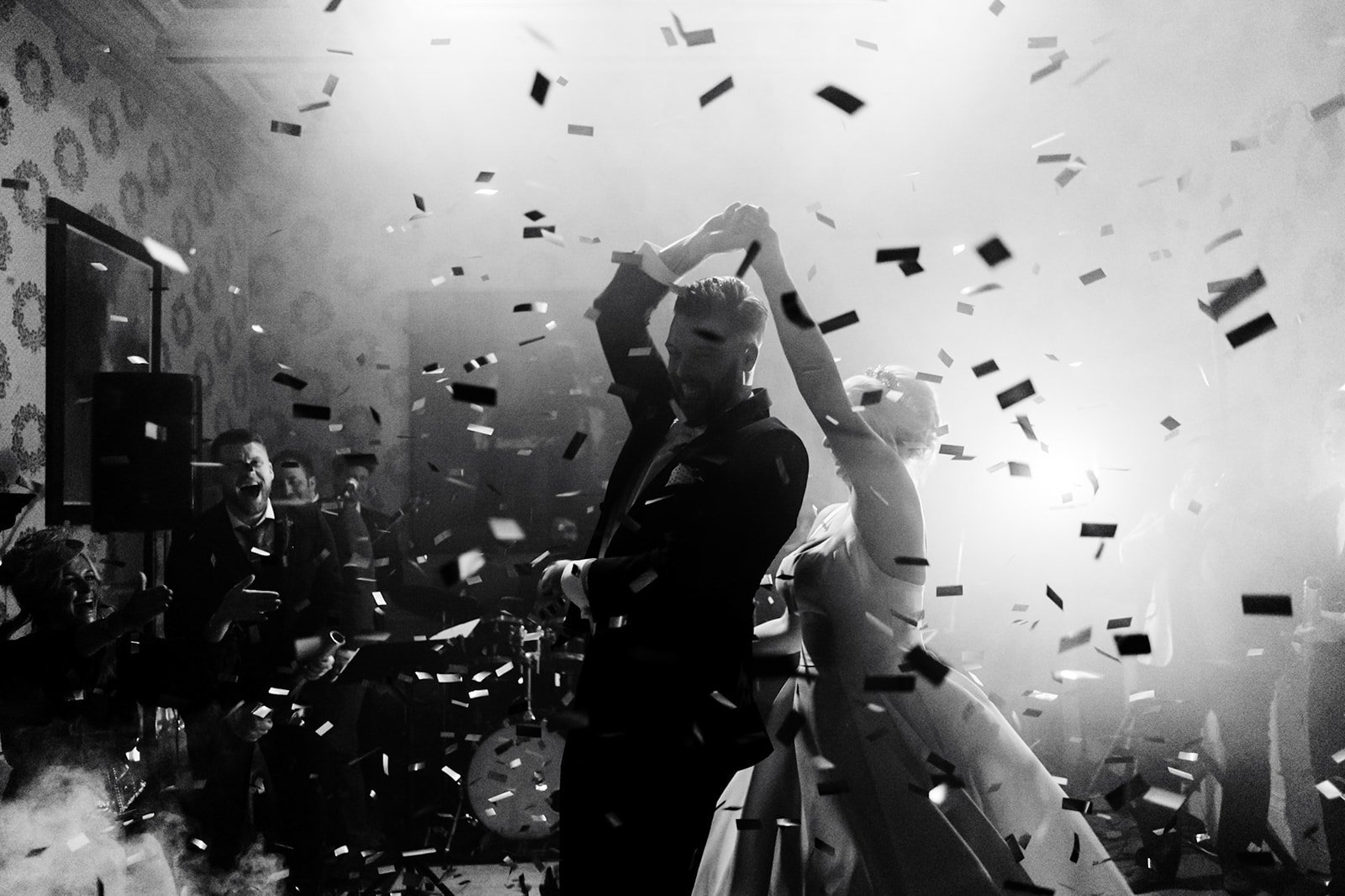 a smokey atmospheric shot of the bride and groom dancing while confetti surrounds them. wedding at toftcombs in Scotland