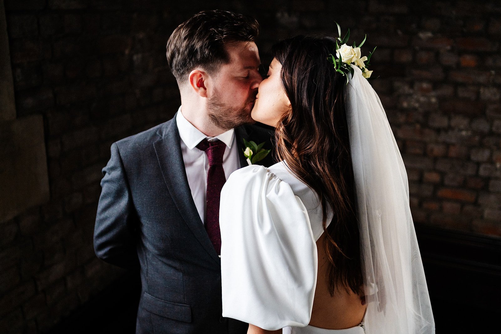 a close up shot of the bride and groom kissing, naturally lit. wedding at dalton old pump house 