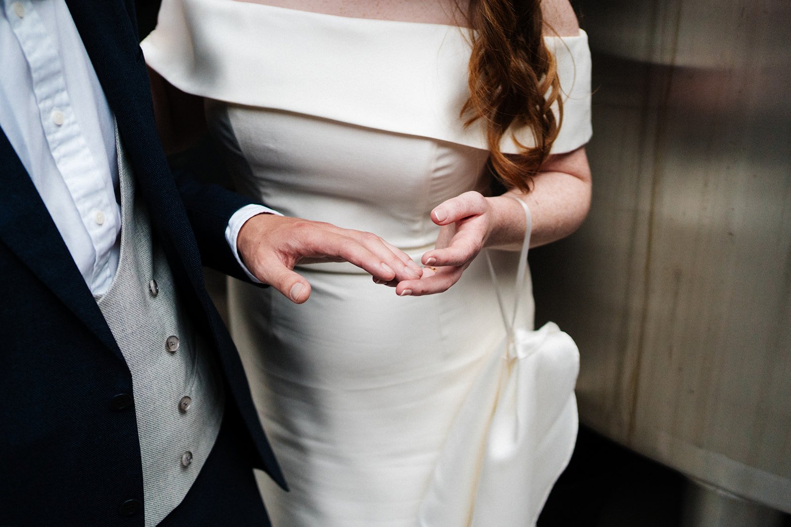 A close-up shot of the bride and grooms hands touching gently. Wedding at Wylam Brewery in Newcastle