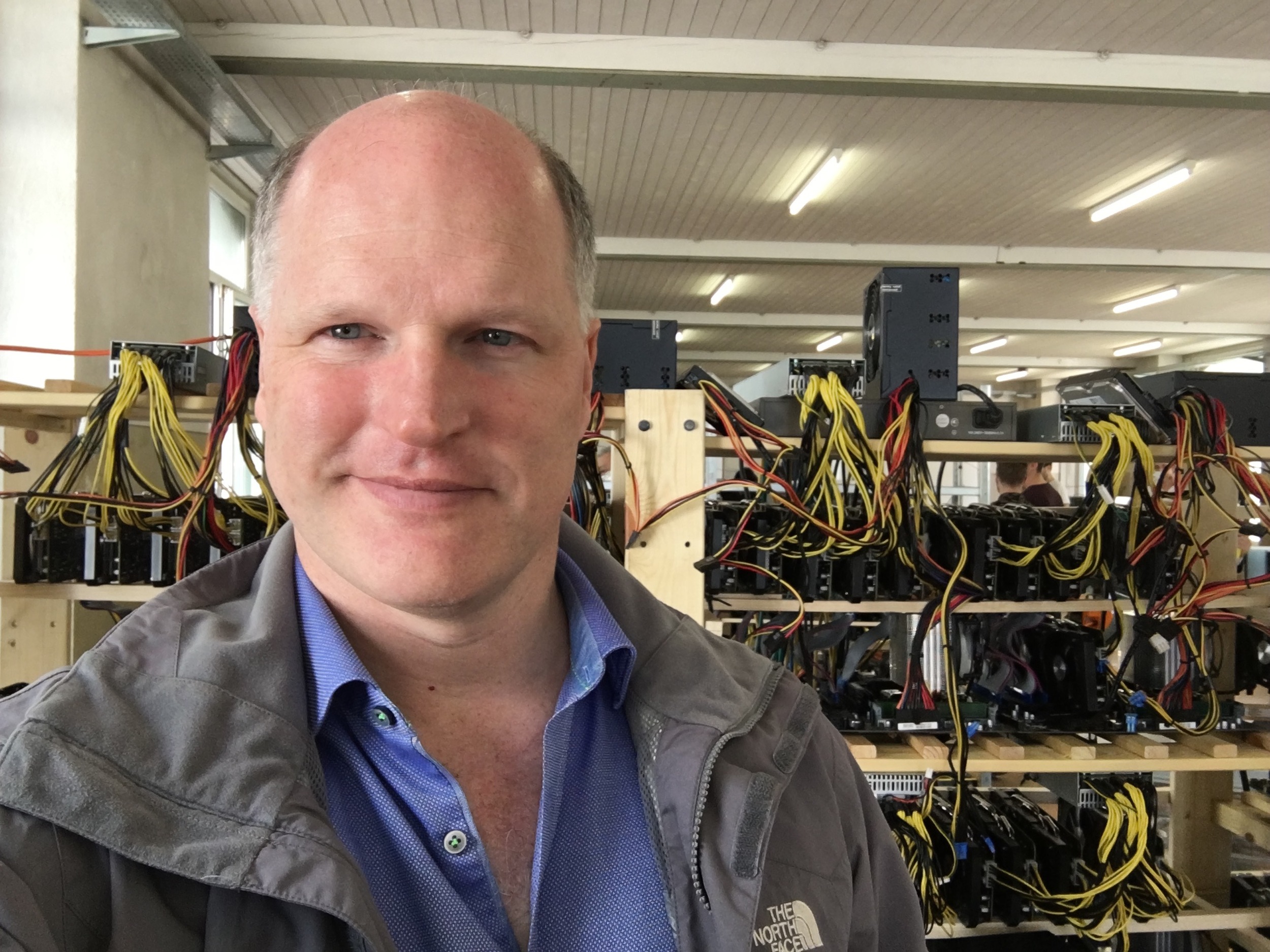 Visiting a bitcoin mine, where electricity is turned into bitcoin, heat, and fan noise.