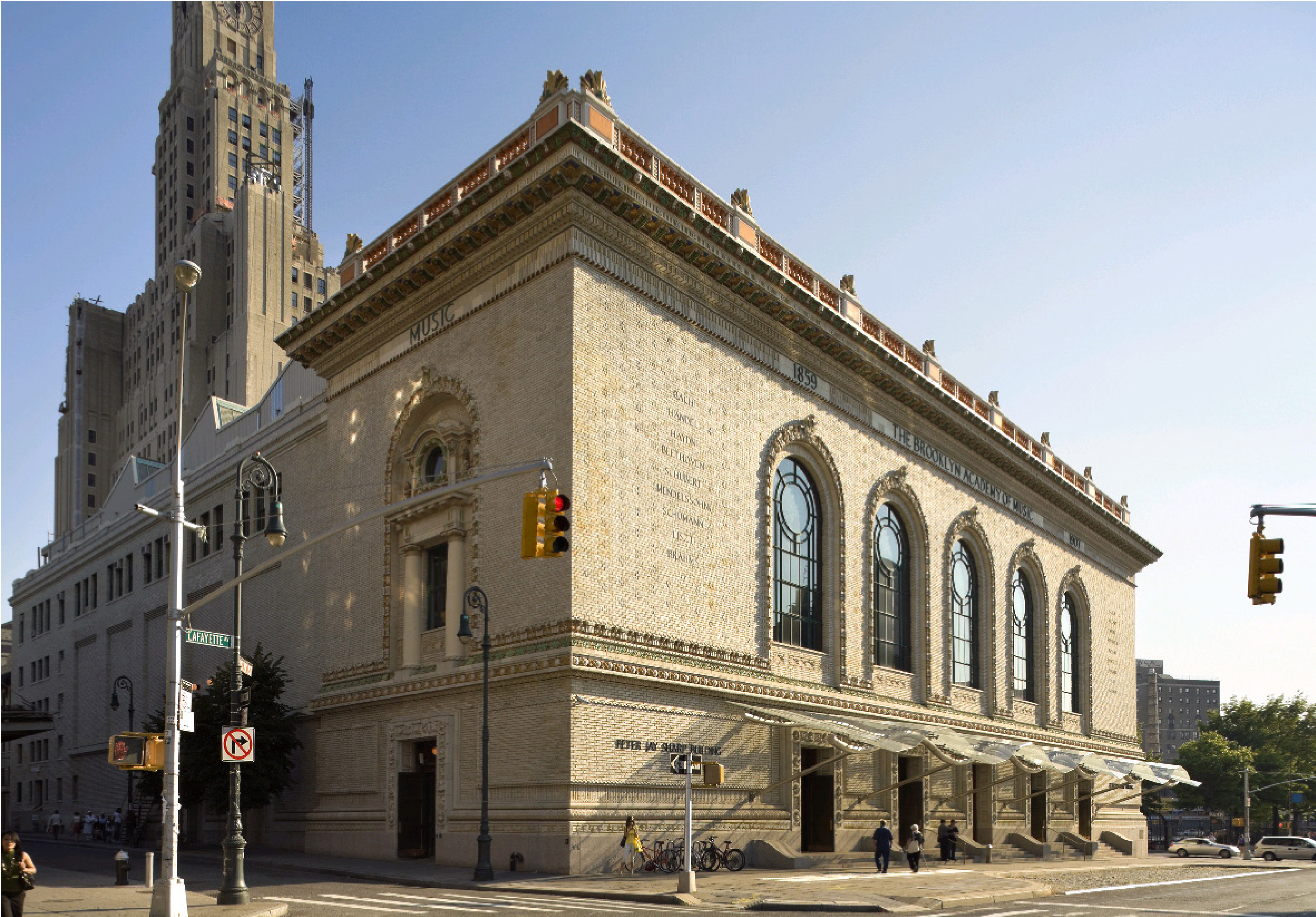 PROJECT: Brooklyn Academy of Music Cultural Arts District CLIENT: Brooklyn Academy of Music COMPLETION: 1987 - 2012 SIZE: 103,000 Square Feet COST: $36 Million Founded in 1908, the Brooklyn Academy of Music (BAM) is America’s oldest performing arts center. For over 20 years, the firm has restored its original 1908 building and designed and implemented several new facilities as part of an overall renewal plan for its neighborhood. Since the creation of the BAM Cultural District in the 1980s, BAM has helped create an energetic, diverse, culturally-driven section of Downtown Brooklyn. Restoration of BAM’s exterior façade included reconstruction of the 15-foot-tall parapet and cornice, restoration of terra-cotta ornamentation, brickwork and lintels, refurbishment of stained-glass windows, signage and enhanced handicapped accessibility. In restoring the 874-seat Harvey Theater, our design changed the original configuration by creating a dramatic arena suggestive of a Greek amphitheater with modern theater technology. We also converted the historic Lepercq Space and Helen Carey Playhouse into the BAMcafé and Rose Cinemas. The result was new primary lobby space and creation of four movie theaters, each with contemporary seating and state-of-the art sound and projection equipment. The facilities allow BAM to host film festivals and show commercial films. To create the new Richard B. Fisher Building, H3 transformed a historic 1928 building into a new home for emerging artists and community groups, innovative arts education programs, and intimate performances. The project adds a 250-seat performance space and a 100-seat rehearsal space to the portfolio of venues at BAM. With LED lighting, an extensive green roof, solar shading, and efficient mechanical systems, the project earned a LEED-NC Gold rating.