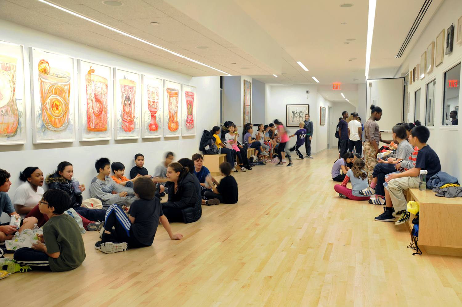 PROJECT: National Dance Institute Center (NDI) for Learning and the Arts CLIENT: National Dance Institute SIZE: 18,000SF COST: $20 Million The new National Dance Institute Center (NDI) for Learning and the Arts is undertook work to create a facility to house four studios, a 175-seat performance space, two galleries and administrative offices. The project was sited on the ground floor and basement of P.S. 90, a mixed-income condominium developed by the Department of Housing Preservation and Development and L + M Development Partners. In keeping with the NDI spirit, the NDI Center is dedicated to children and to education, and will allow NDI to offer expanded after-school, weekend, and summer programs; train professional artist to work with a diverse range of learners; offer a flexible, rentable studio/performance space in which commission, create, and present performances and visual arts; and provide continued opportunities for cultural exchange and global awareness. The character of the Center blends clean, bright, open spaces with colorful art and murals. Windows between studios and hallways allow students and visitors to observe dance in action throughout the space. Flexibility is a key element in the design; for example, the gallery doubles as an additional dance studio for small practices and performances. The administrative offices are bright, efficient, and airy, and provide a high-performance work environment for NDI staff and administration. After 35 years, NDI finally has a vibrant, permanent home and new environment in which to continue its mission of giving kids a chance at success.