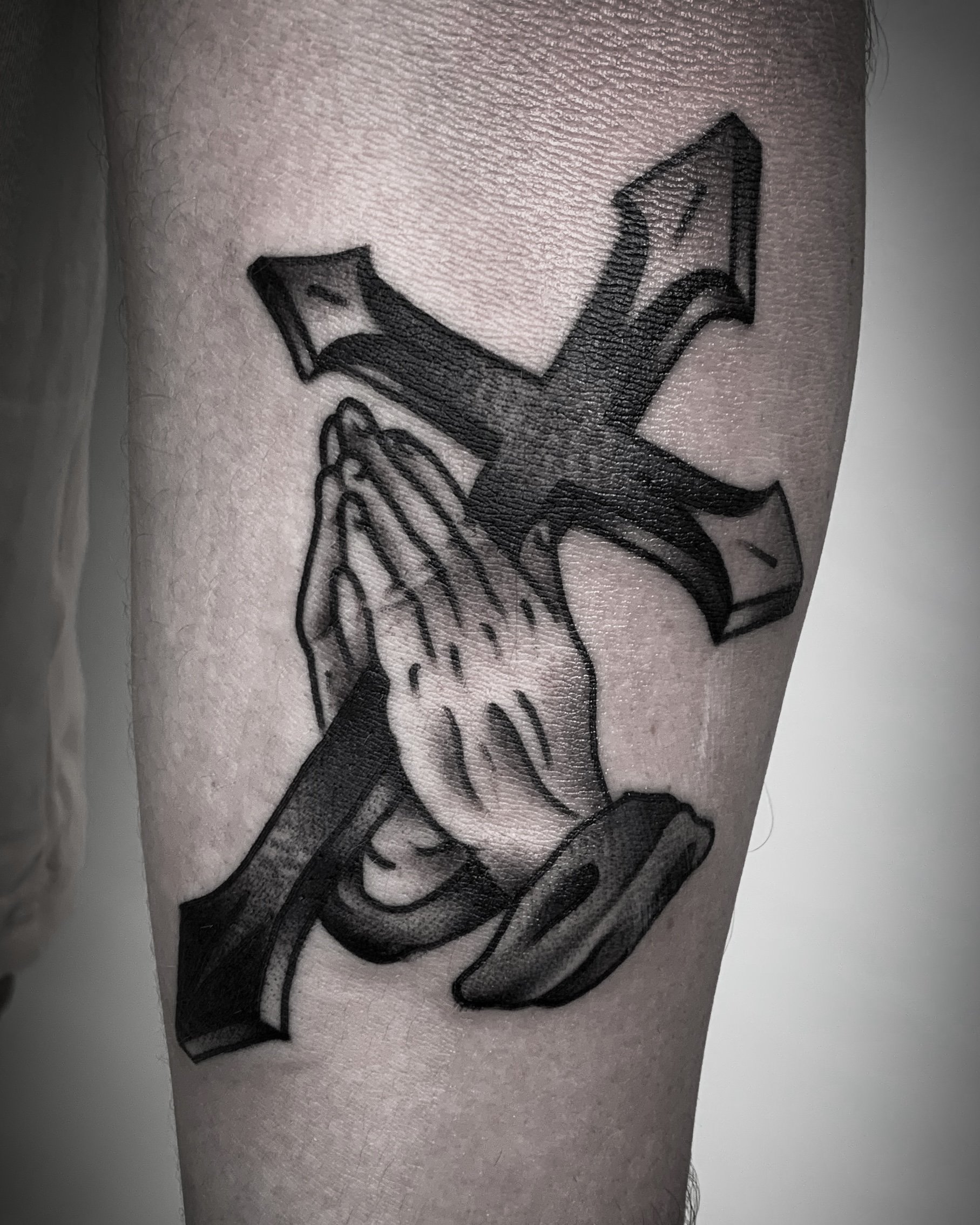 christian-otto-traditional-black-and-grey-cross-praying-hands-tattoo-los-angeles.jpg