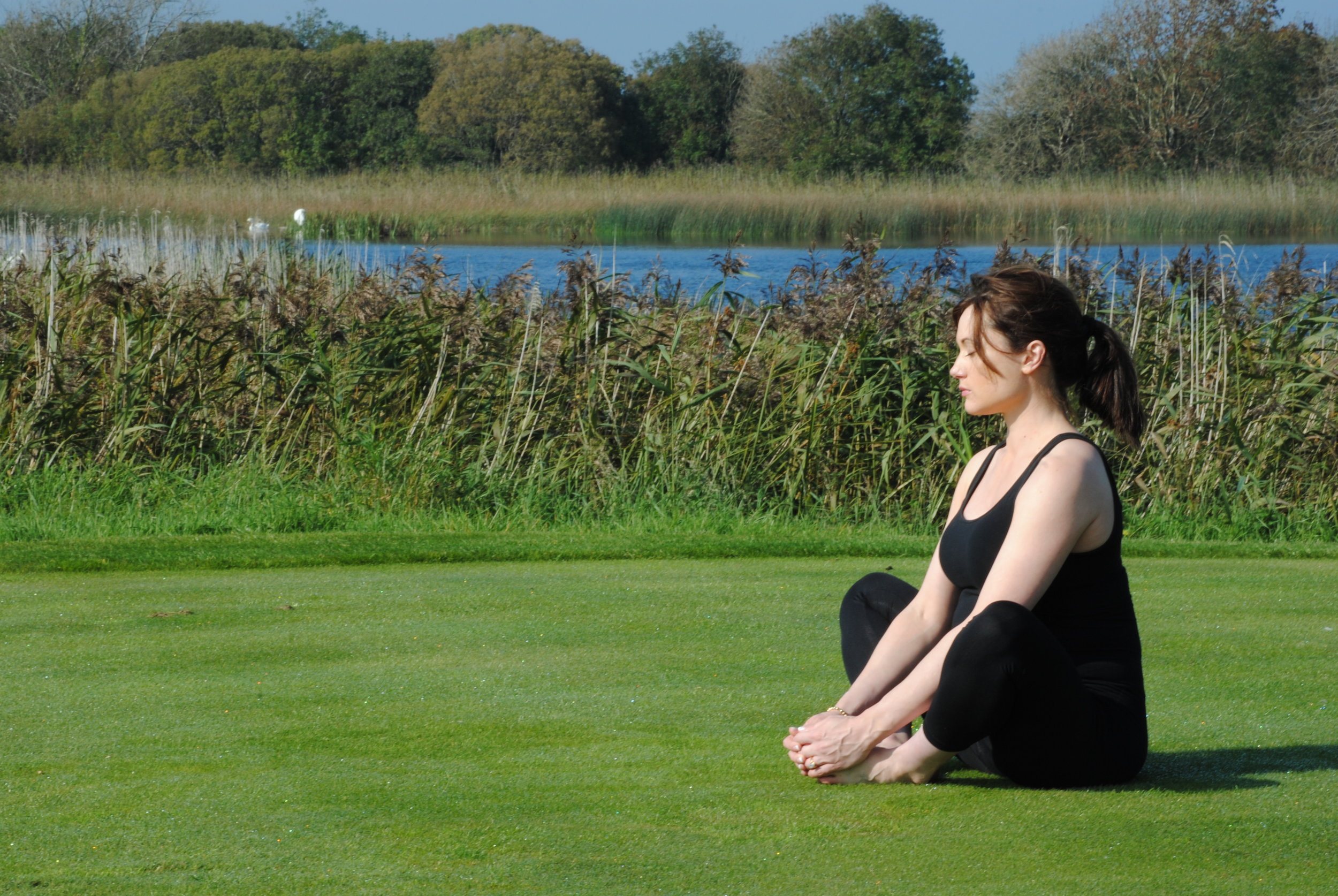 Deirdre, one of Anna's private clients enjoying a mindful nature meditation, at Glenlo Abbey, Galway.