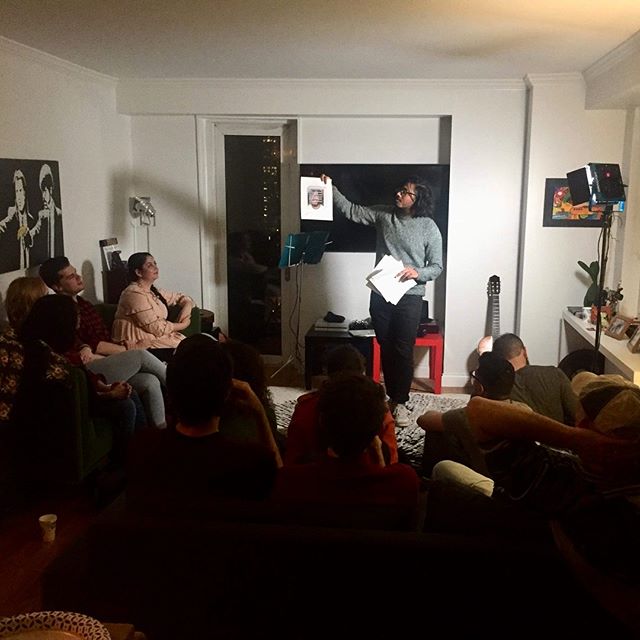 Comedian @rajat.suresh (The Onion, New Yorker, Clickhole) shows off the cover of his definitely real book to an audience eating a lot of doughnuts at the &quot;Doughnuts &amp; Comedy&quot; showcase in @sofiamonzerratt's living room. Organized by @ian