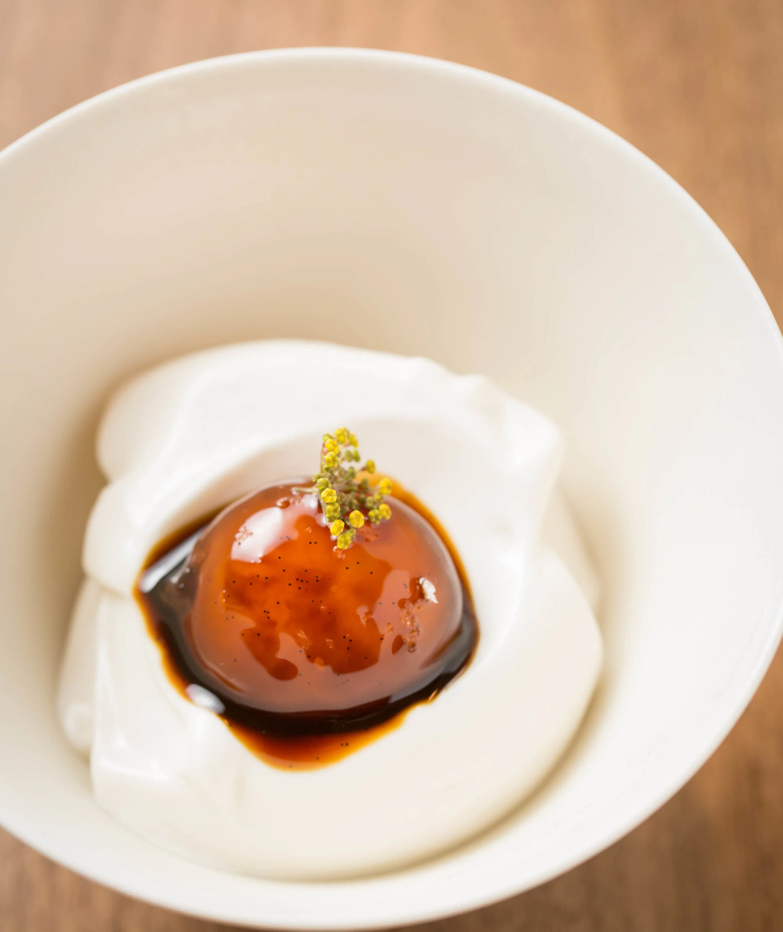 Dessert at Smyth, an egg yolk soaked in salted licorice with frozen yogurt meringue (photo by Huge Galdones @galdophoto.com).
