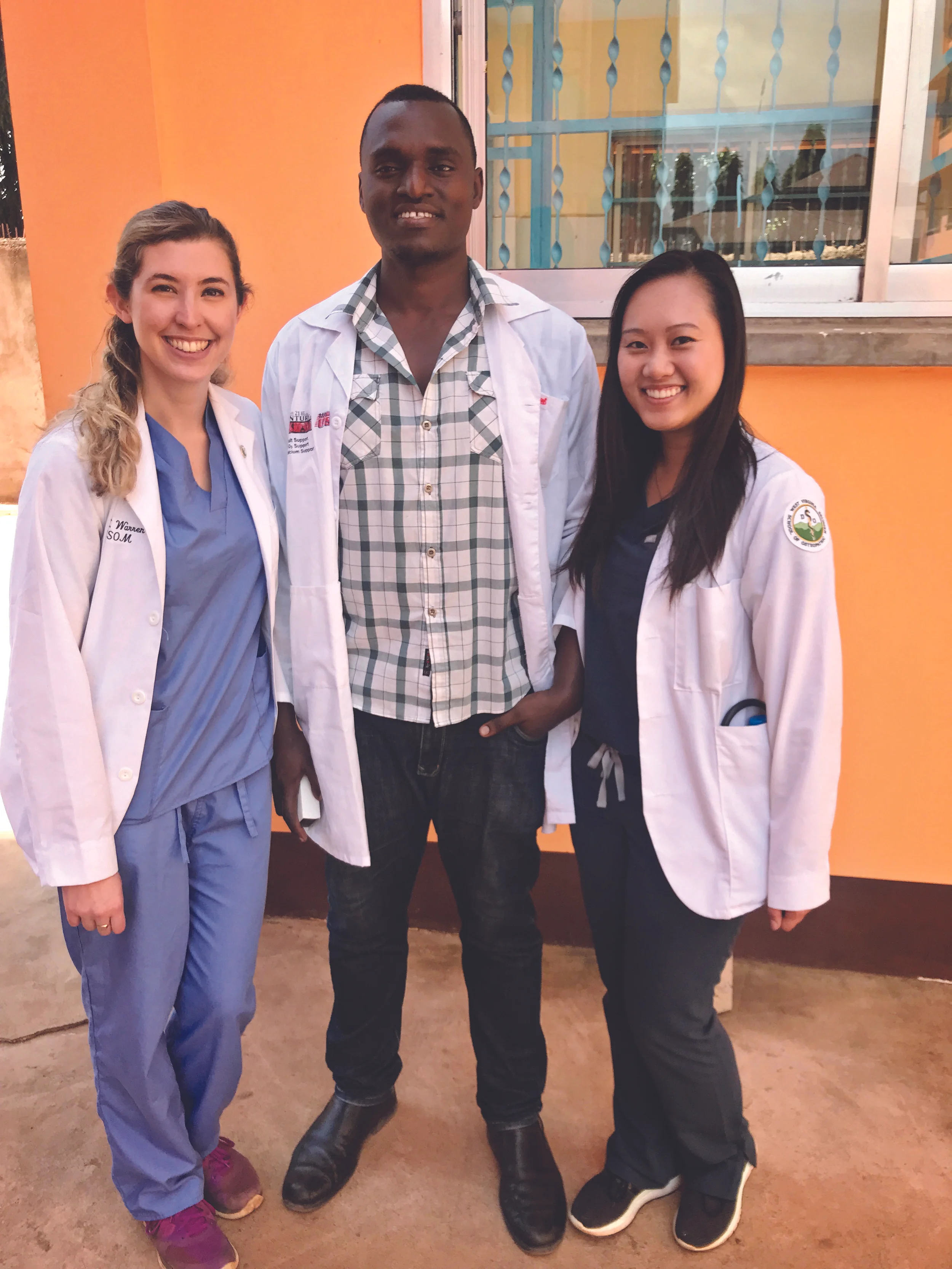 Kate Warren, Dr. Geophrey Mboye, and Vivian To
