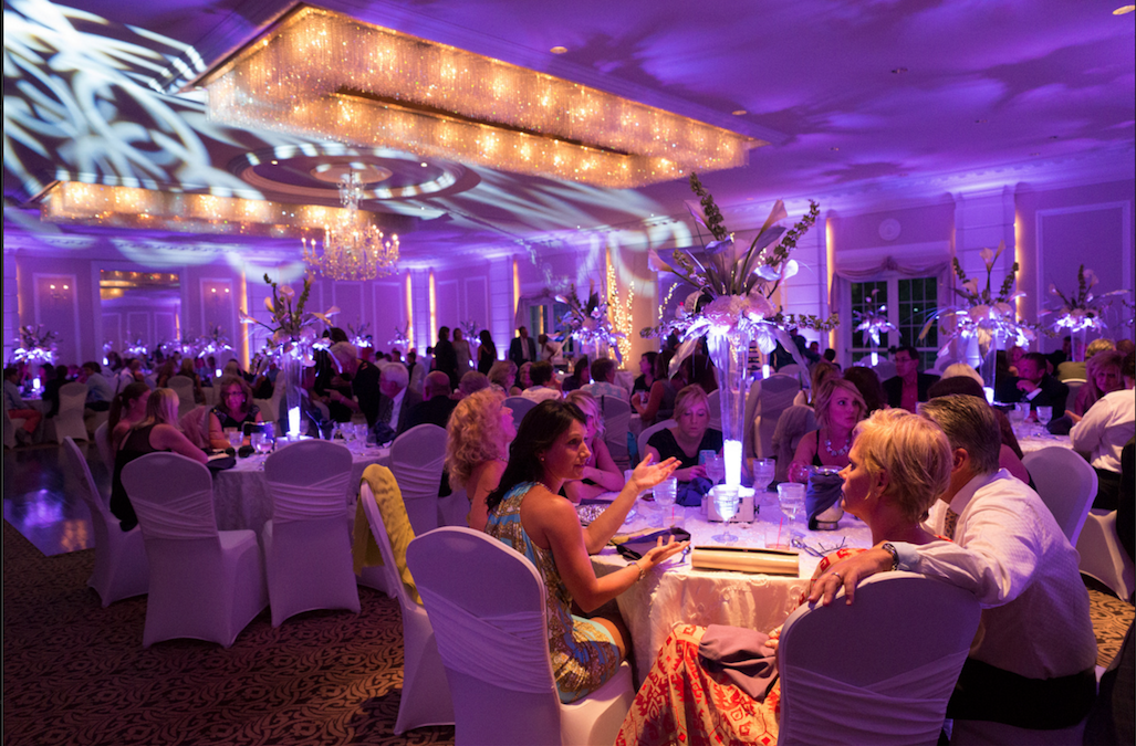 Purple Uplighting with our Luminate Dance Floor Lighting and Lighted Centerpieces.