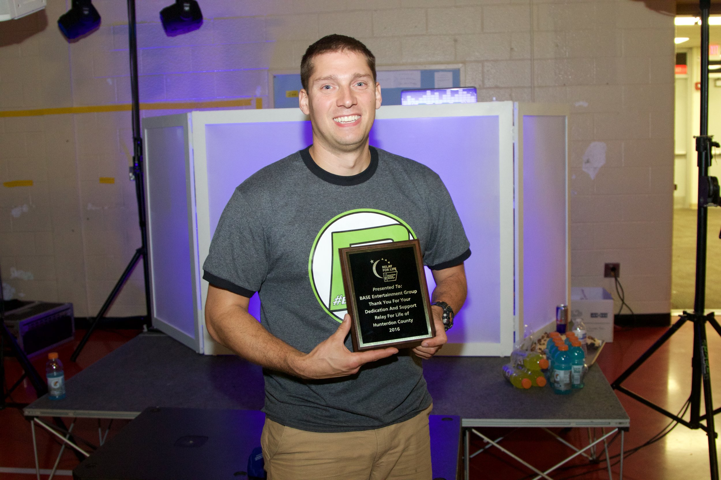 Rob Case (Owner) with an award from Relay for Life 