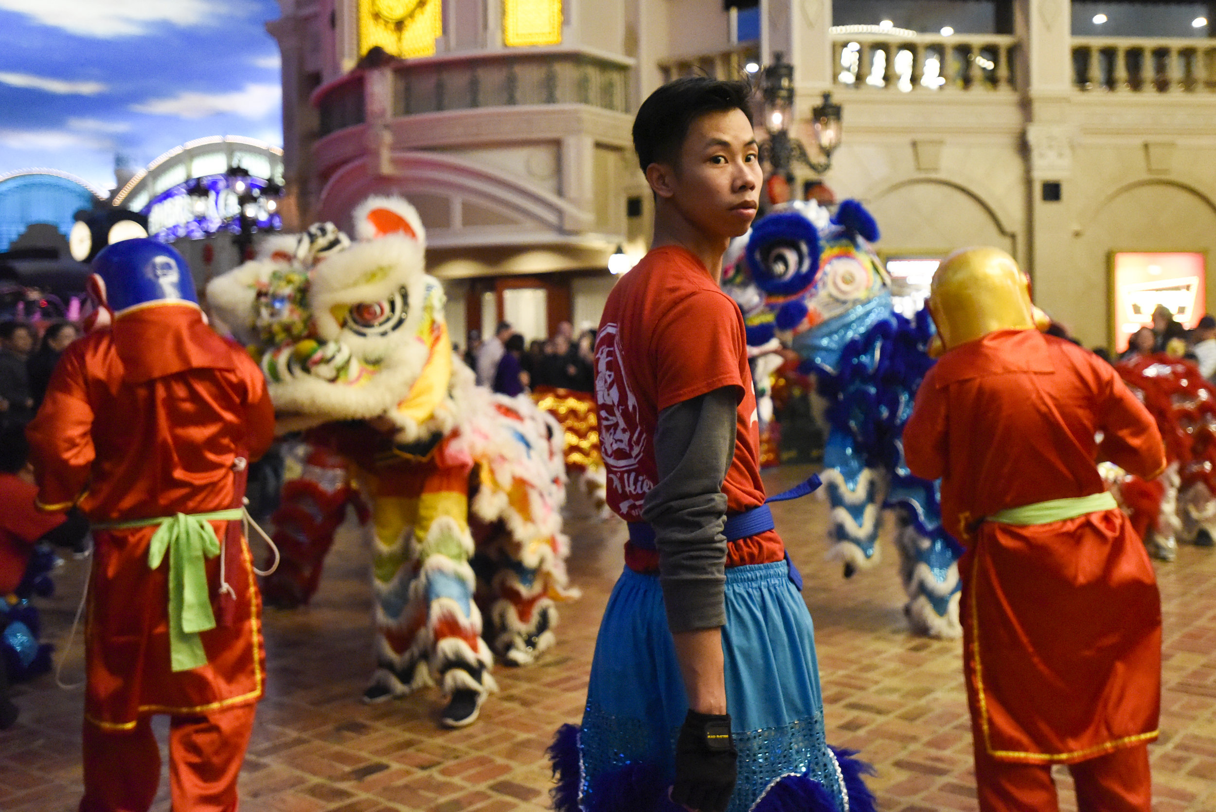 Daniel Van, 25, looks down the path to see when he should lead the lion dance troupe to its next obstacle stage on Saturday, Feb. 17, 2018 at Ameristar Casino in Kansas City, Missouri. Van started dancing with Phổ Hiền Lion Dance Troupe in 2012. He