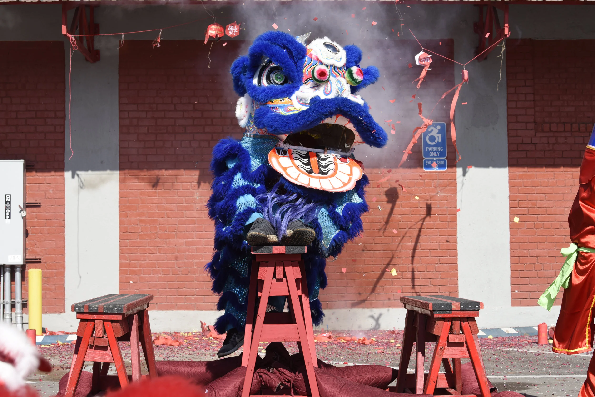  The blue lion from Phổ Hiền Lion Dance Troupe sits on a trick stand during a performance on Feb. 17, 2018 at Chinatown Food Market in Kansas City, Missouri. Dancers Daniel Van and Kieu Duong used the blue lion for all of their performances during th