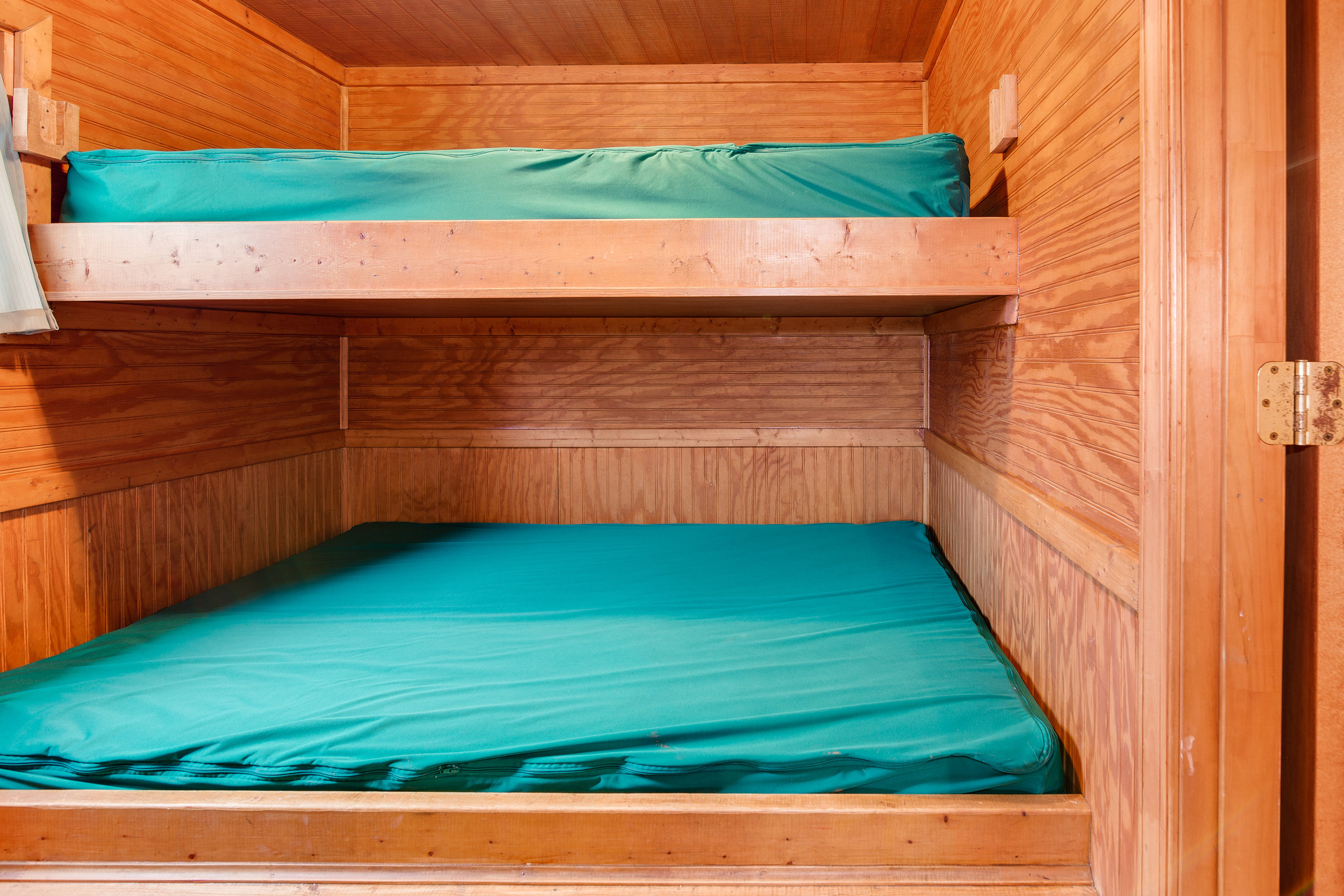  Pictured here, the bedroom of DK6 includes a full-size bed on the bottom bunk with a twin bed above it. Please plan to bring your own linens. 