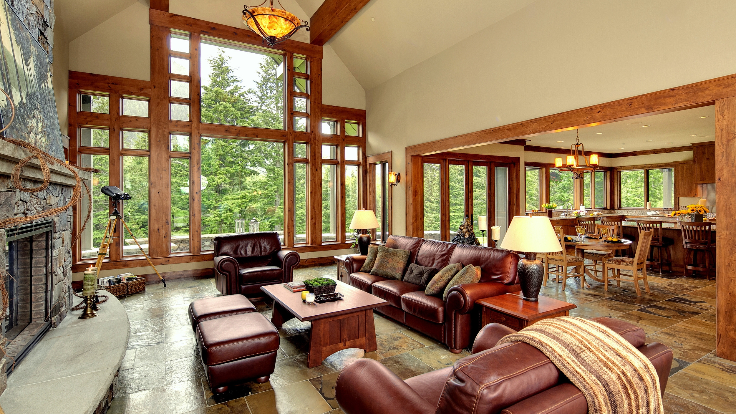   Lodge Style with a Great View   timber beams, window walls, and slate floors 