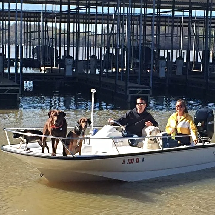 Owners Chase and Crystal Schrecker boating with their babies.