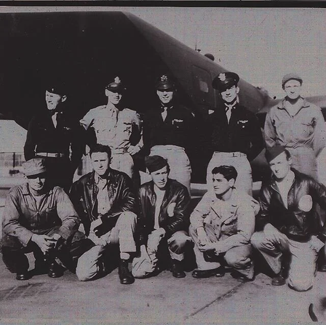 Standing next to his B-24 with his hat cocked to the side and his crew. After heavy flack he kept it in the air long enough for all of them to get out.  Later captured and a POW.  So proud of him.