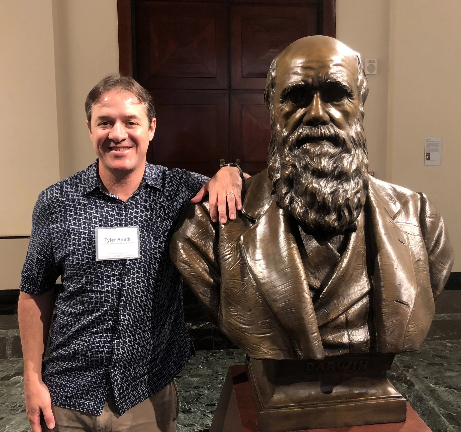 Dr. Smith with a bust of Charles Darwin inside the National Academy of Sciences headquarters. The IIRCR’s inaugural meeting took place on February 8, 2018. 