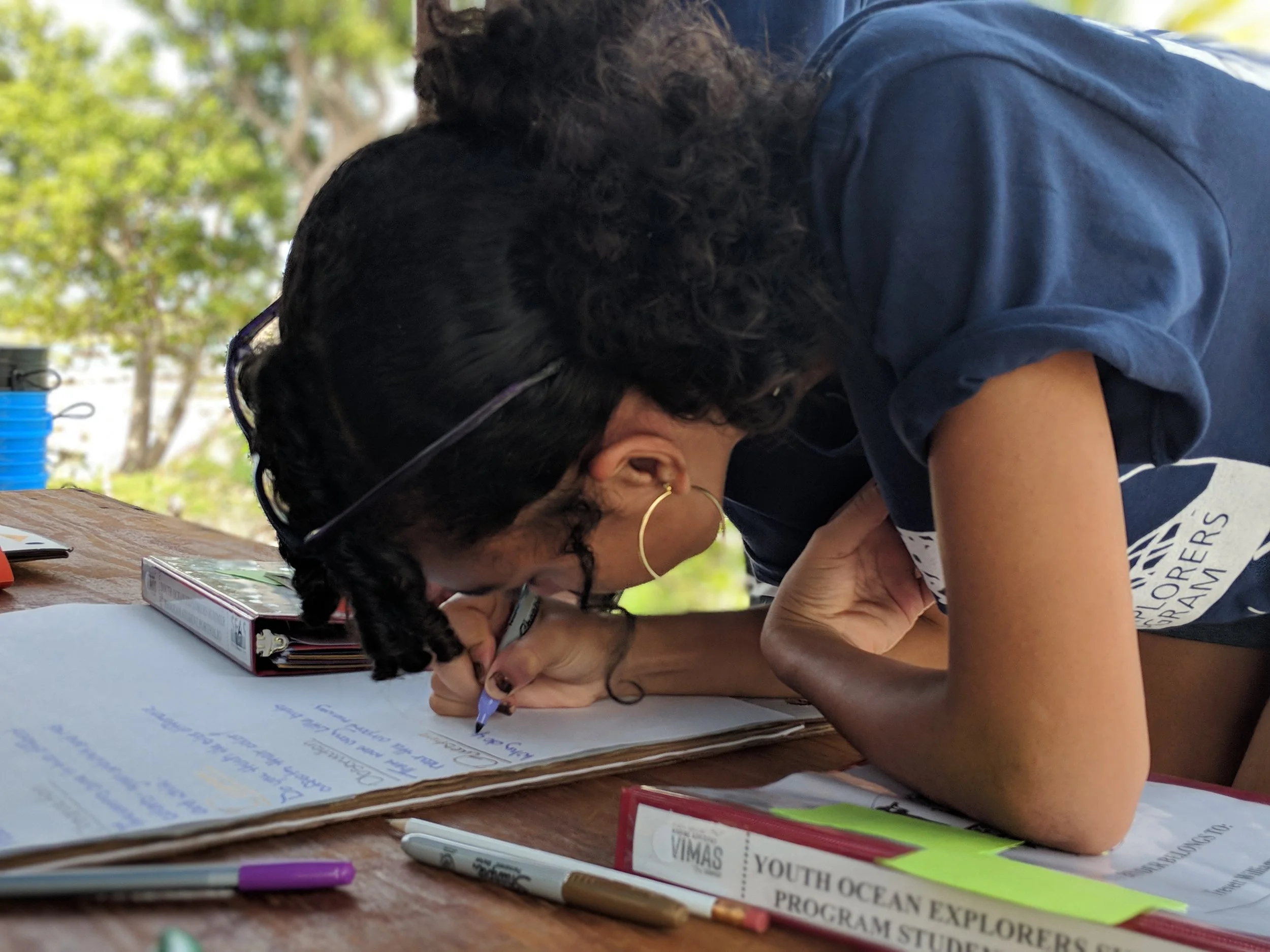 YOE student compiling field data into a visual chart.
