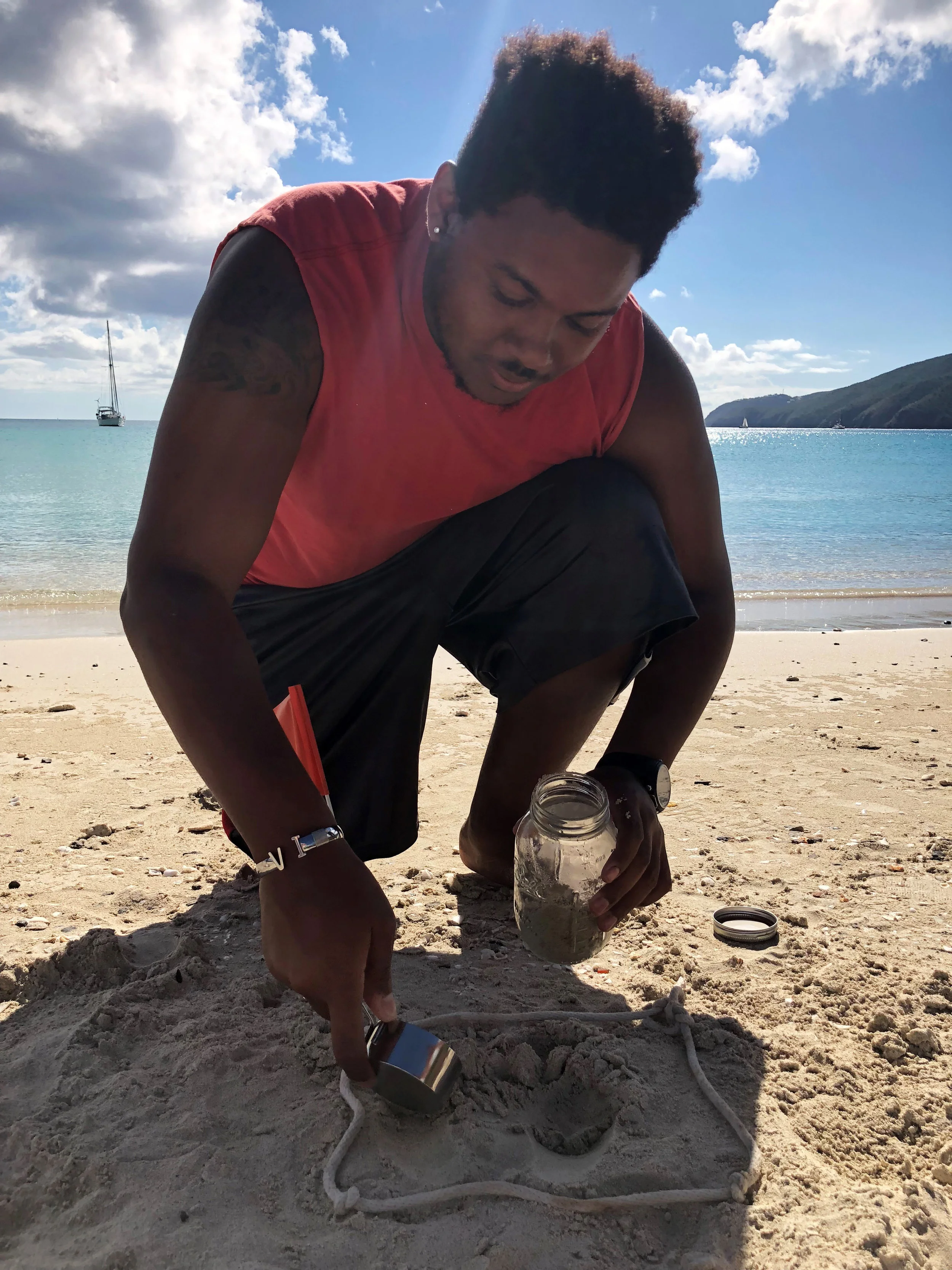 Always a willing volunteer, Kyle assists another Masters student with micro plastic collection. Photo: Kristin Wilson Grimes