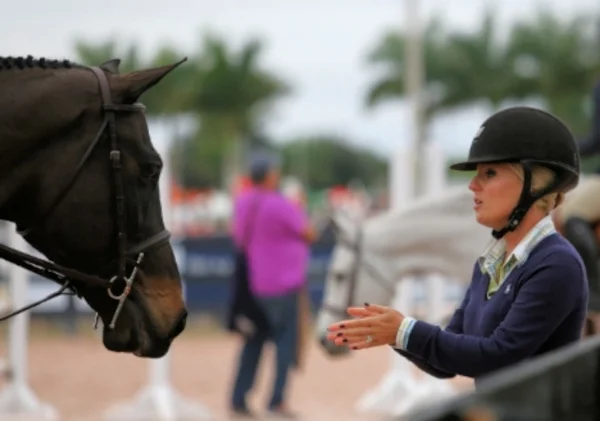 Jodi Vazquez coaches a student after her round. Photo by Carrie Wirth