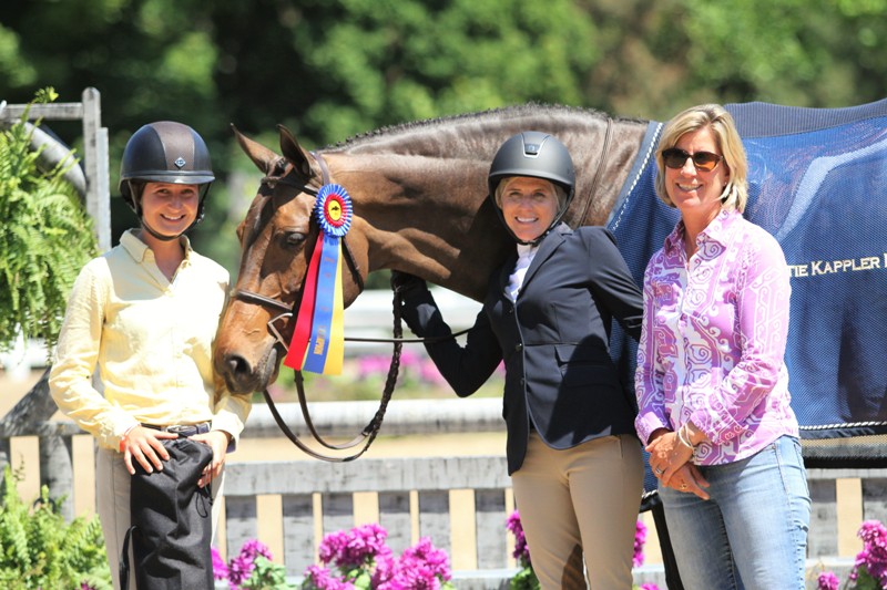 From left, professional rider Savannah Talcott, Kiersten Litzsinger and head trainer Katie Kappler with Baroness Blixen. Amateur Adult Hunter 36-49 Division Champion Baroness Blixen and her owner/rider, Kiersten Litzsinger, succeeded in the Adult Hunter 36-49 as the division champions. “She is the love of my life,” Litzsinger said. “I want to put her in my backyard, but they won’t allow it. We’re very connected, we’re good friends. She got hurt after a year of the pre-greens, and she was out for a year. So, I just savor every moment that she’s going and healthy. She was brand new to hunters at the time I had got her. That was five years ago this month. I’ve had many people try to buy her and I will not ever give her up.”