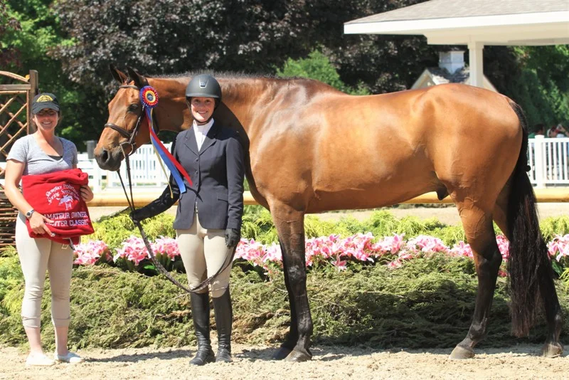 Timeless and Lesley Quillen Amateur Owner 3’3 B-Section Champion $1000 Amateur Owner Classic Timeless, with his owner/rider Lesley Quillen, were the Section-B Amateur Owner 3’3” division champions. The duo also reeled in the Amateur Owner Classic. “This is our second week, so he was a little more tired this week,” Quillen said. “He ended up first and second over fences today so he was really good, so I’m really happy with him.” Quillen and “Tommy” won the classic last week during the Showplace Spring Spectacular I, but still had some things to work on. “We’ve been working on my pace. I like to go very slow and we’re working on getting that going, so I think that’s finally clicking. This is my third summer with him, so we’re finally on the same page.”