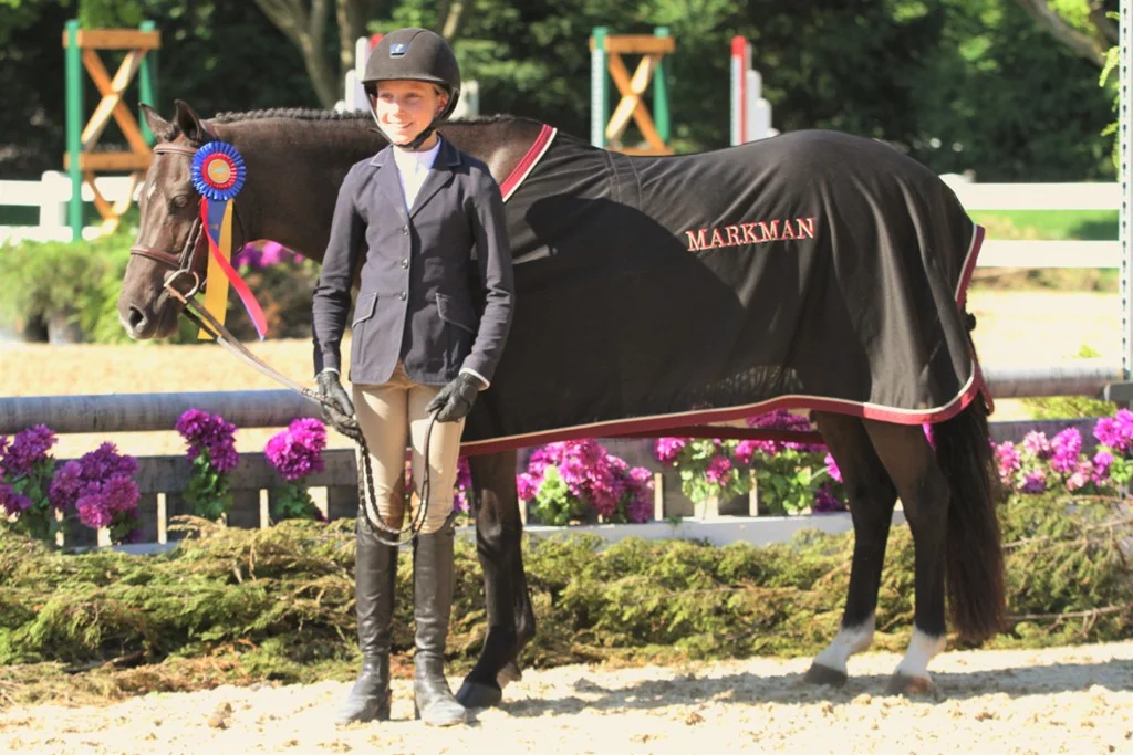 Benlea Mizzou and Olivia Markman Small Pony Hunter Champion Benlea Mizzou and Olivia Markman won the Small Pony Hunter division championship.