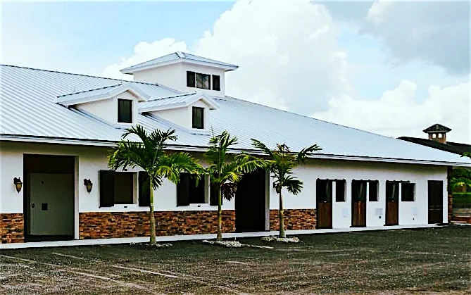 The property features grass paddocks and an arena with GGT footing and lighting.