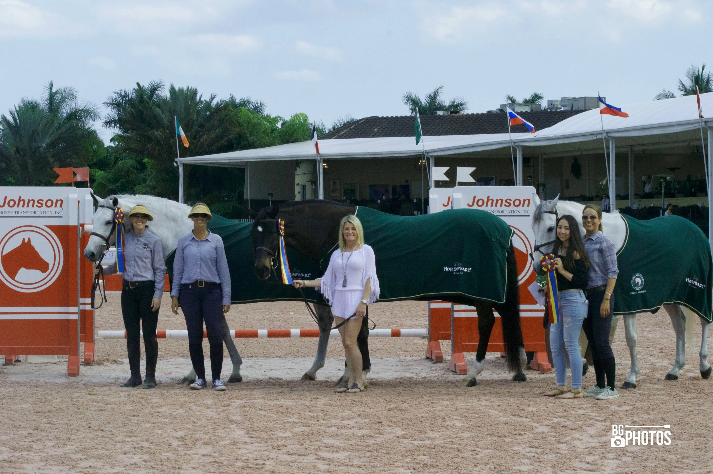 A few of East Wind's 2017 WEF Circuit Champions. Karoleena Low Adult Hunter champion with owner Christy Powell (not pictured) with assistant trainer Maggie Gould, Tiffany Morrissey, Calero and Susannah Rose (Adult Amateur Hunter), Ren Round Number and Catherine Wu (Adult Modified Jumper), assistant trainer/rider Lisa Funk. Photo by B. Giacin Photos