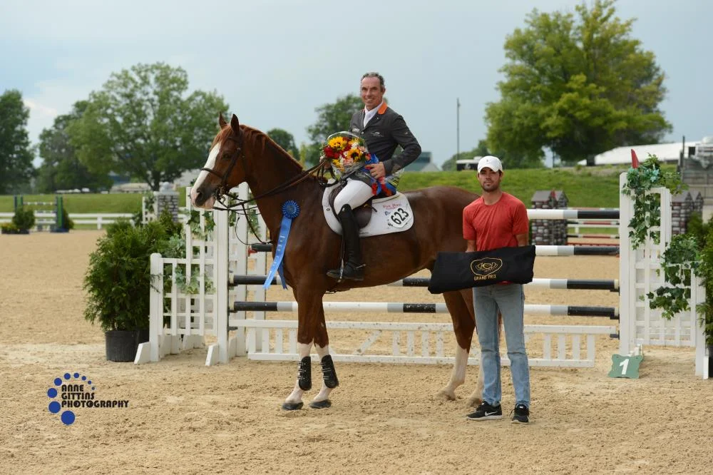 Wilhelm Genn accepts the award with Bugatti and son Ryan Genn.Photo by Anne Gittins Photography