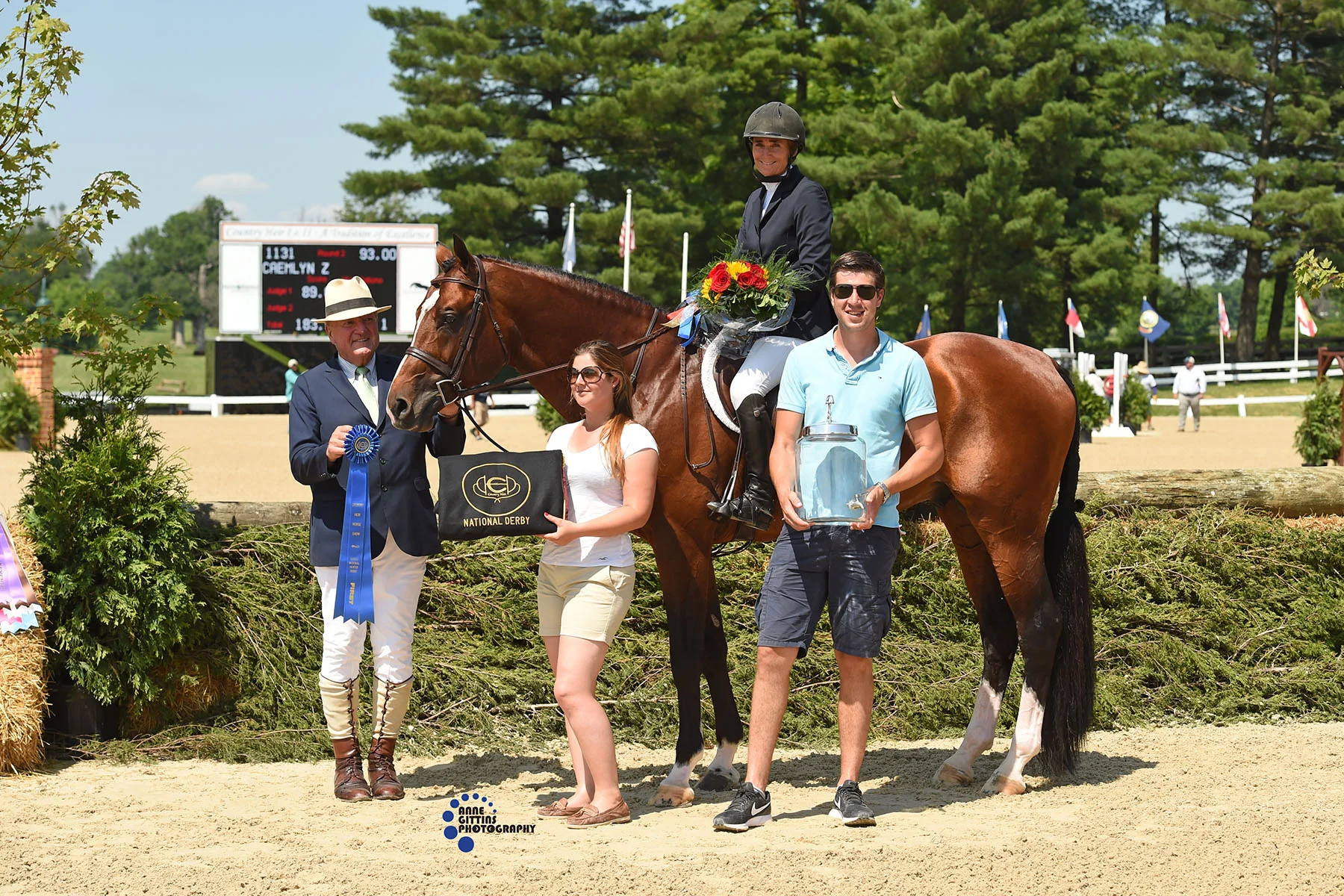 Ringmaster John Fanzreb with MiximeTyteca and Niels Haesen presenting the USHJA National Derby award to Havens Schatt and Caemlyn Z. Photo by Anne Gittins Photography