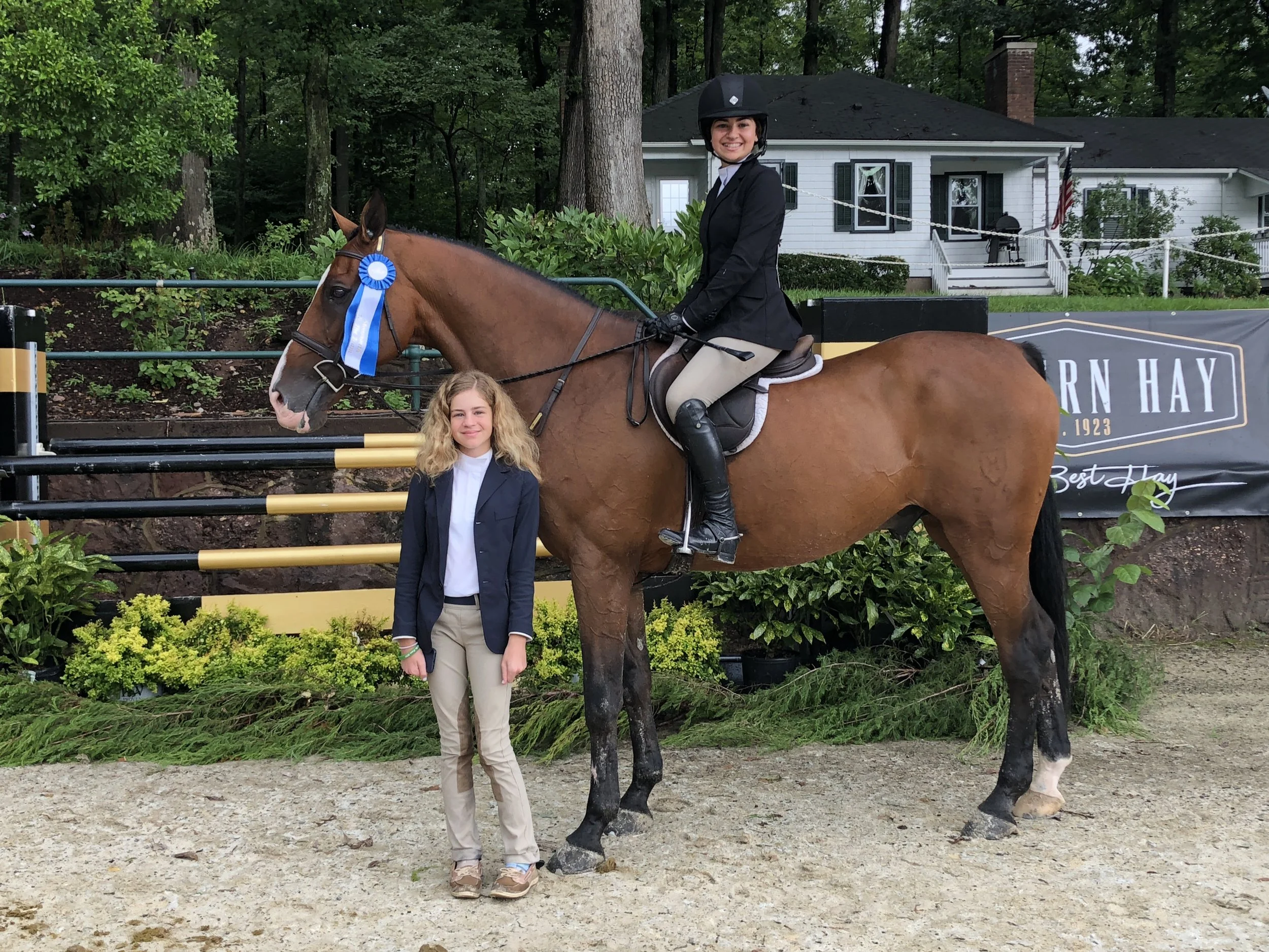 Sophia Chimenti poses with her sister Mia aboard Chocolat 15. The sisters each earned medals on the opening day of Monmouth at the Team. Photo by EQ Media.