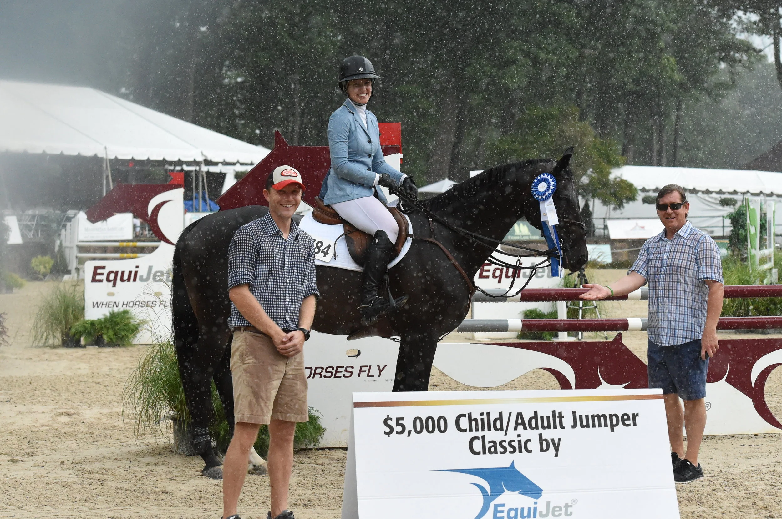 Jessie Lampe and Rehbein accept their award from Bastian Schröeder, president of EquiJet and Tucker Ericson, co-owner of Monmouth at the Team.Prizes included a bridle from CWD and a Back on Track Therapeutic Mesh Sheet. Photo by Anne Gittins Photography